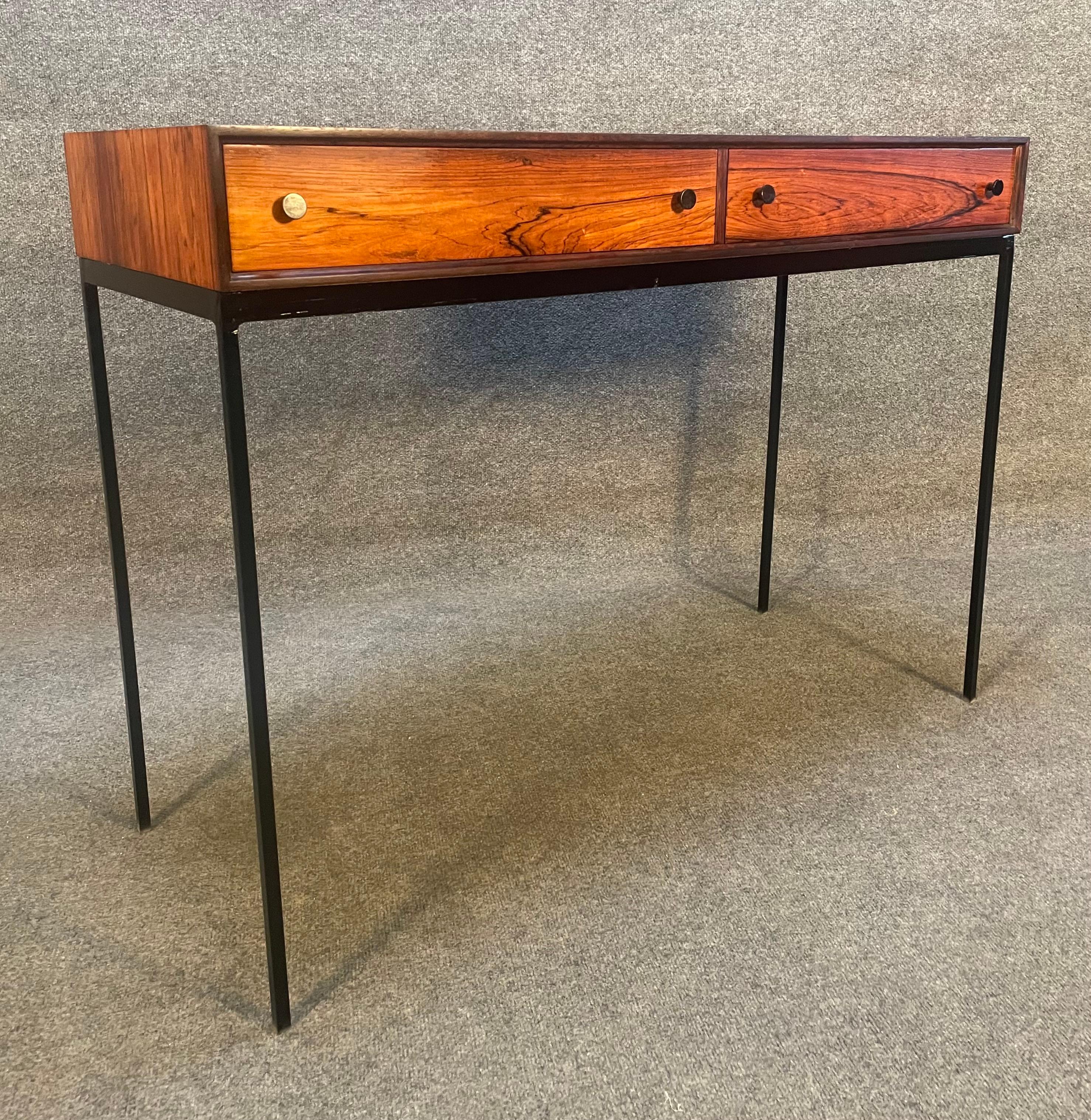 Here is a beautiful Scandinavian Modern entry way console in rosewood designed by Poul Norreklit and manufactured in Sweden in the 1960s.
This lovely case piece, recently imported from Europe to California before its restoration, features a vibrant