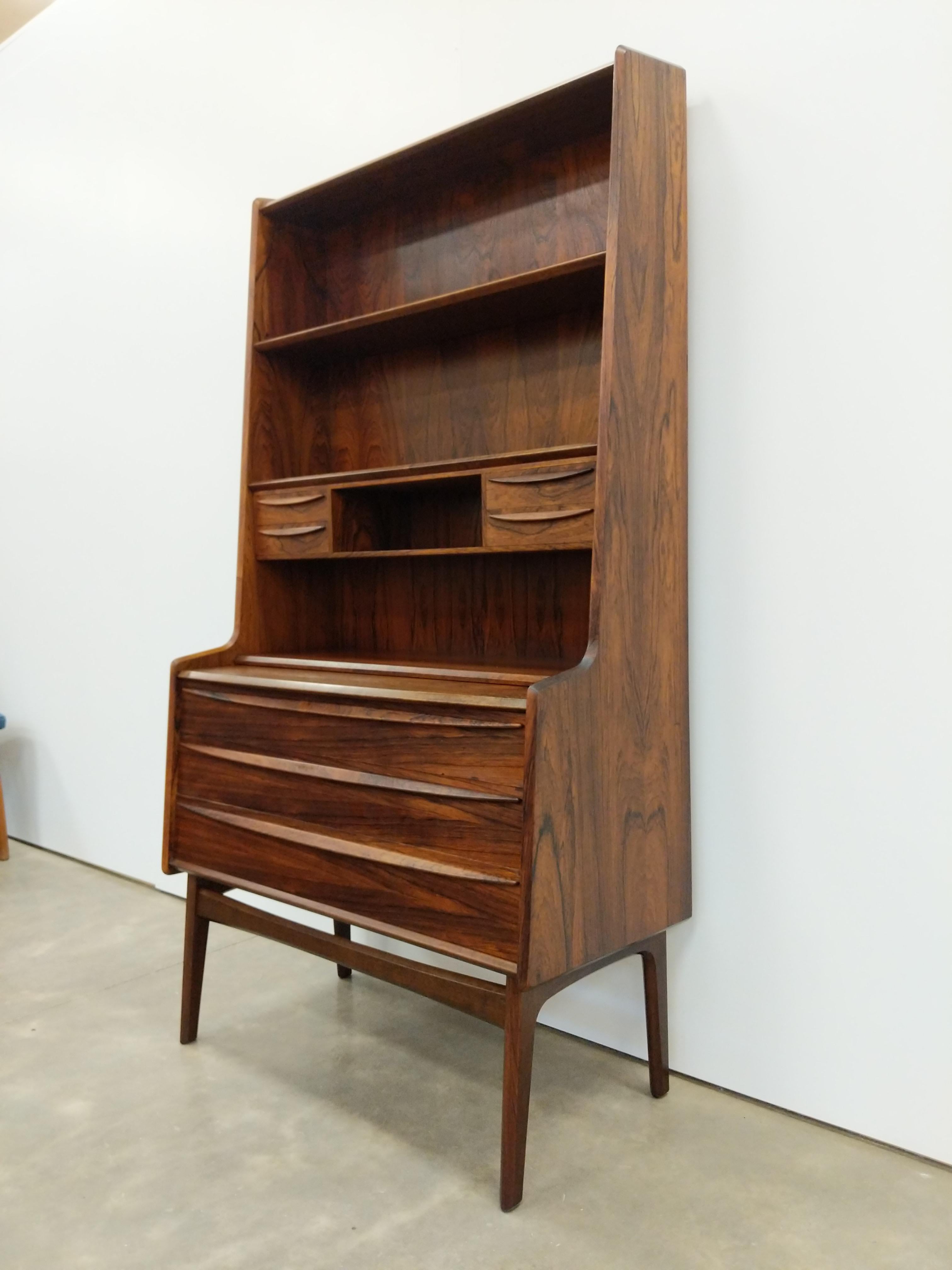 Authentic vintage mid century Danish / Scandinavian Modern rosewood secretary desk / bookshelf / dresser / chest of drawers.

This piece is in excellent condition with few signs of age-related wear (see photos).

If you would like any additional