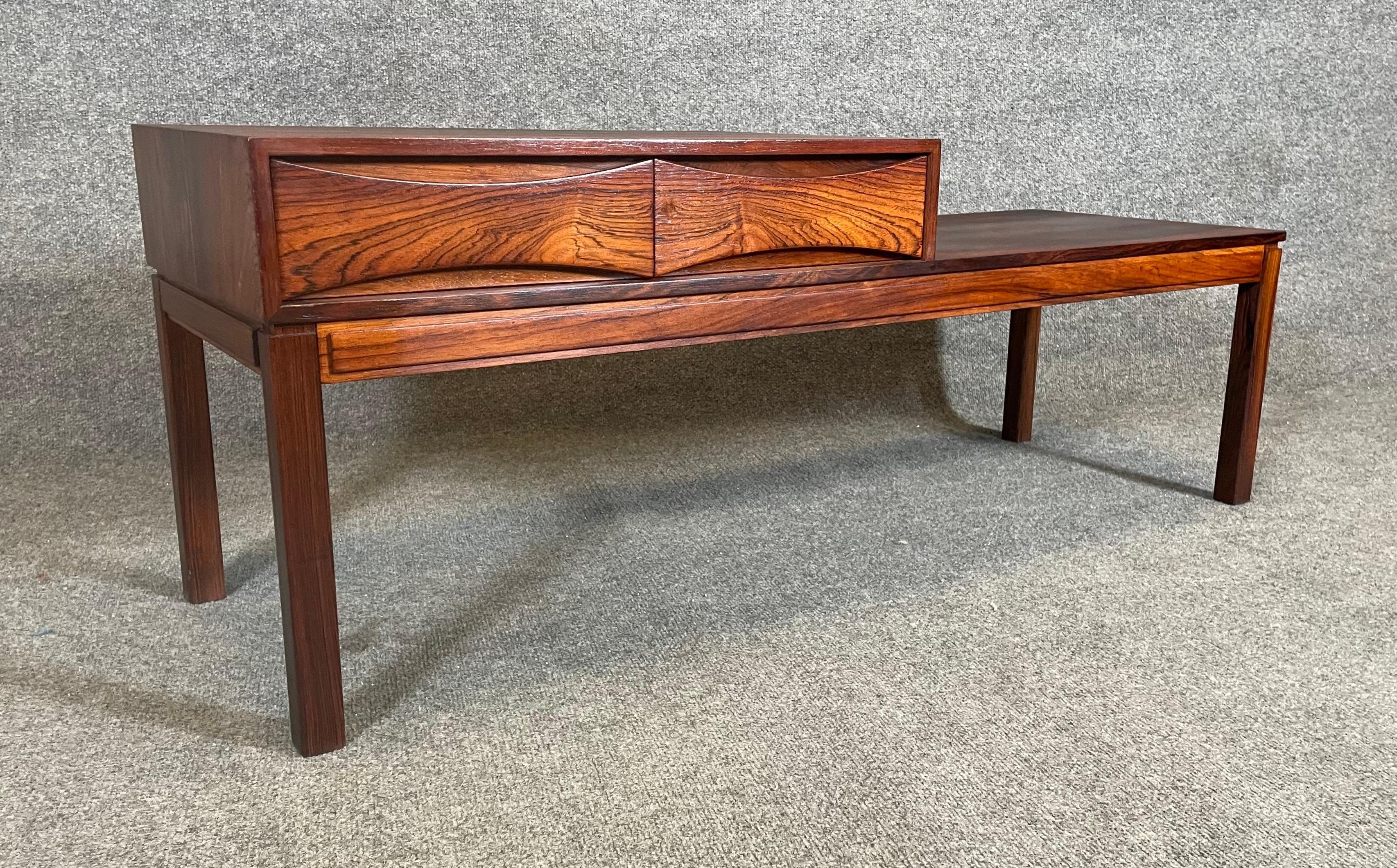 Here is a beautiful scandinavian modern telephone-entry bench in rosewood manufactured by Wards Ateljéer in Denmark in the 1960's.
This exquisite piece, recently imported from Europe to California before its refinishing, features a vibrant wood