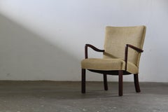 Poltrona danese vintage in teak massiccio della metà del secolo scorso, anni '50