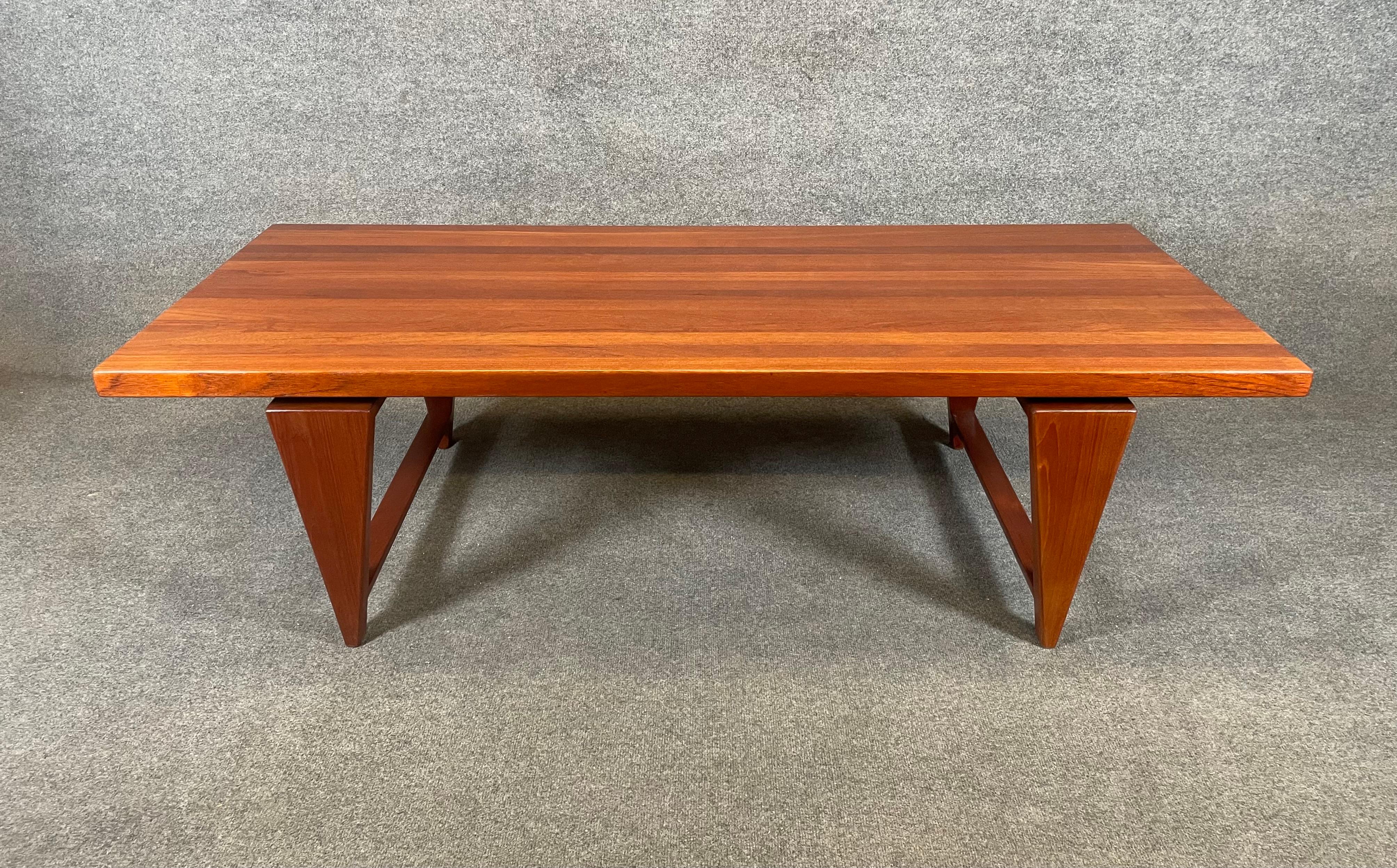 Here is a beautiful Scandinavian modern cocktail in solid teak designed by Illum Wikkelso and manufactured by Mickael Laursen in Denmark in the 1960's.
This special table, recently imported from Europe to California before its refinishing, features