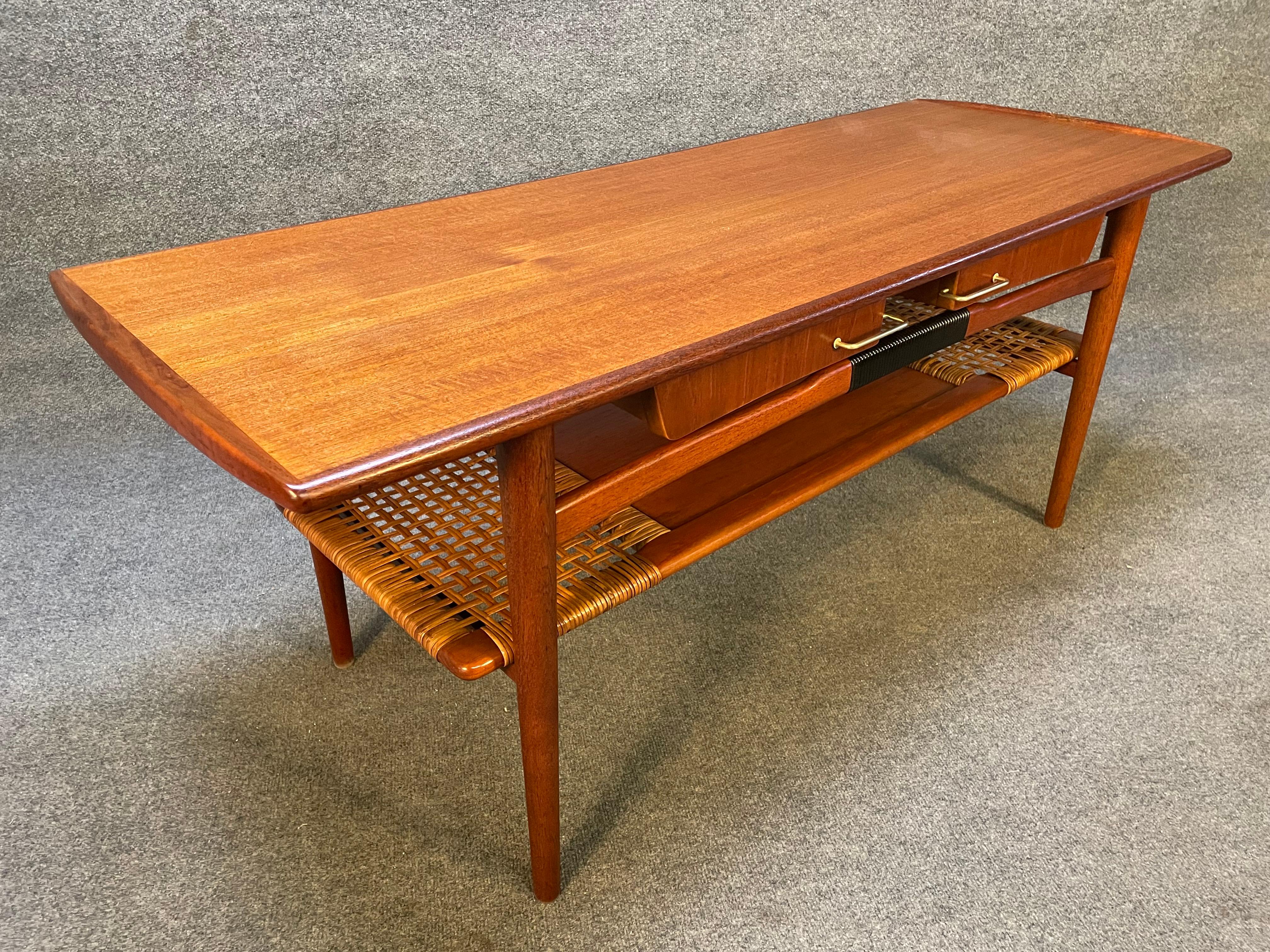 Here is a beautiful 1960's scandinavian modern teak coffee table reminiscent of Hans Wegner's design manufactured in Denmark in the 1960's.
This special table, recently imported from Europe to California before its refinishing, features a vibrant