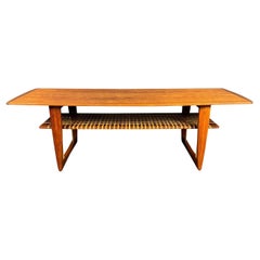 Vintage Danish Mid Century Modern Teak Coffee Table With Rattan Magazine Shelf