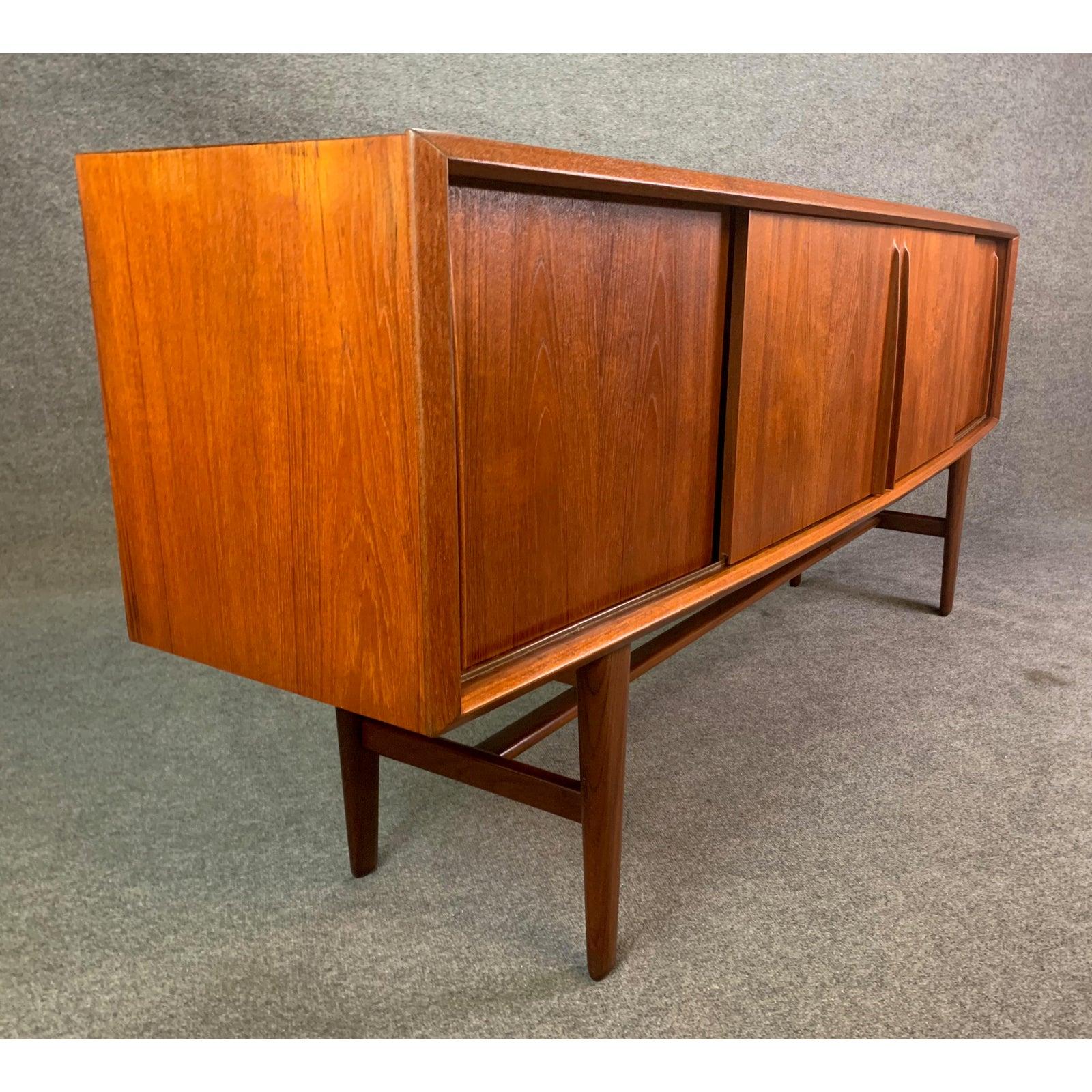 Here is a sought after Scandinavia modern sideboard in teak wood designed by Arne Vodder and manufactured by H.P. Hansen in Denmark in the 1960s.
This exquisite piece, recently imported from Copenhagen to California before its restoration, features