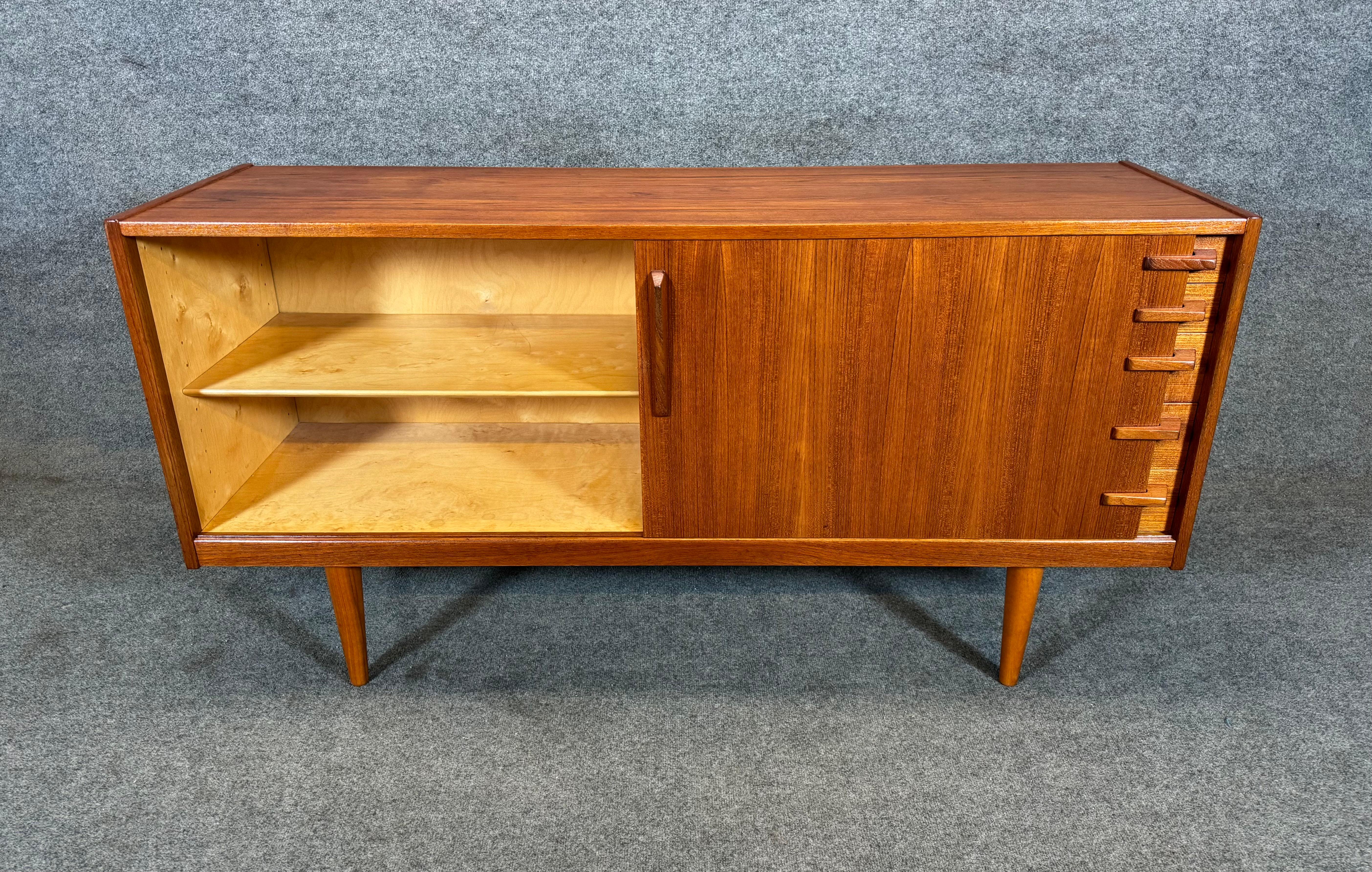 Here is a beautiful scandinavian modern compact sideboard in teak designed by Yngve Ekström and manufactured by Hugo Troeds in Sweden in the 1960's.
This lovely case piece, recently imported from Europe to California before its refinishing, features