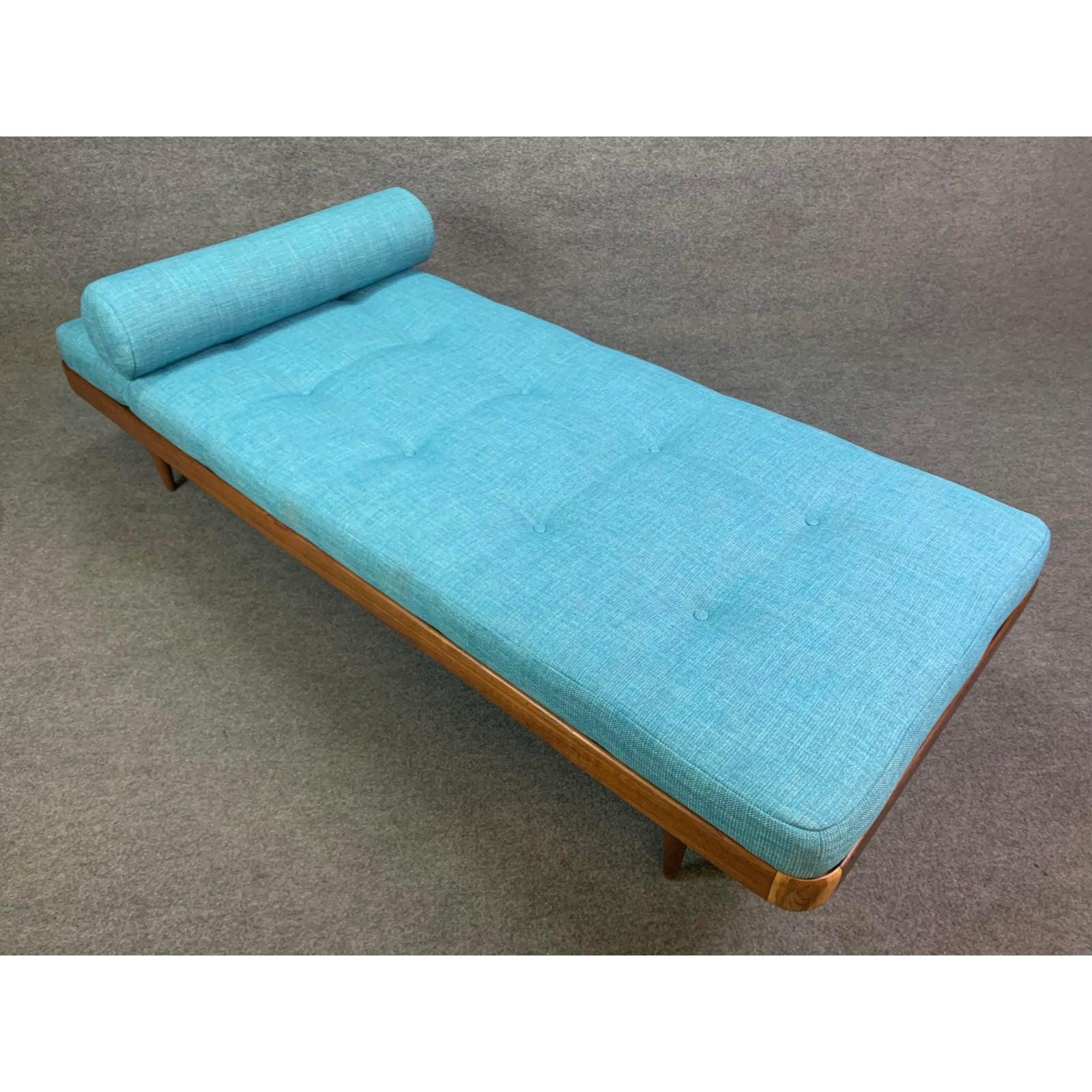 Here s a beautiful Scandinavian Modern daybed with a teak frame that was recently imported from Denmark to California before its restoration.
This lovely and comfortable piece features a solid teak frame with solid wood slats and legs and a brand