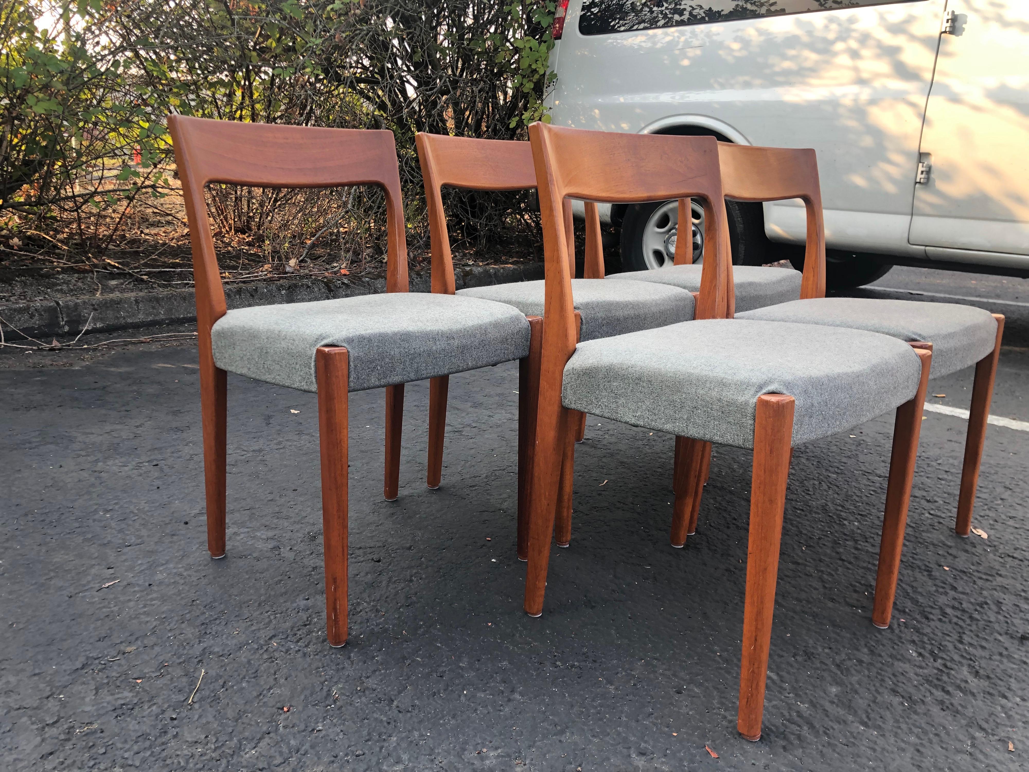 We are delighted to offer for sale this lovely suite of four original Danish teak dining chairs. These chairs have those beautiful lines you only find with very fine Danish chairs. They are in solid teak with fully reupholstered light gray pads, not