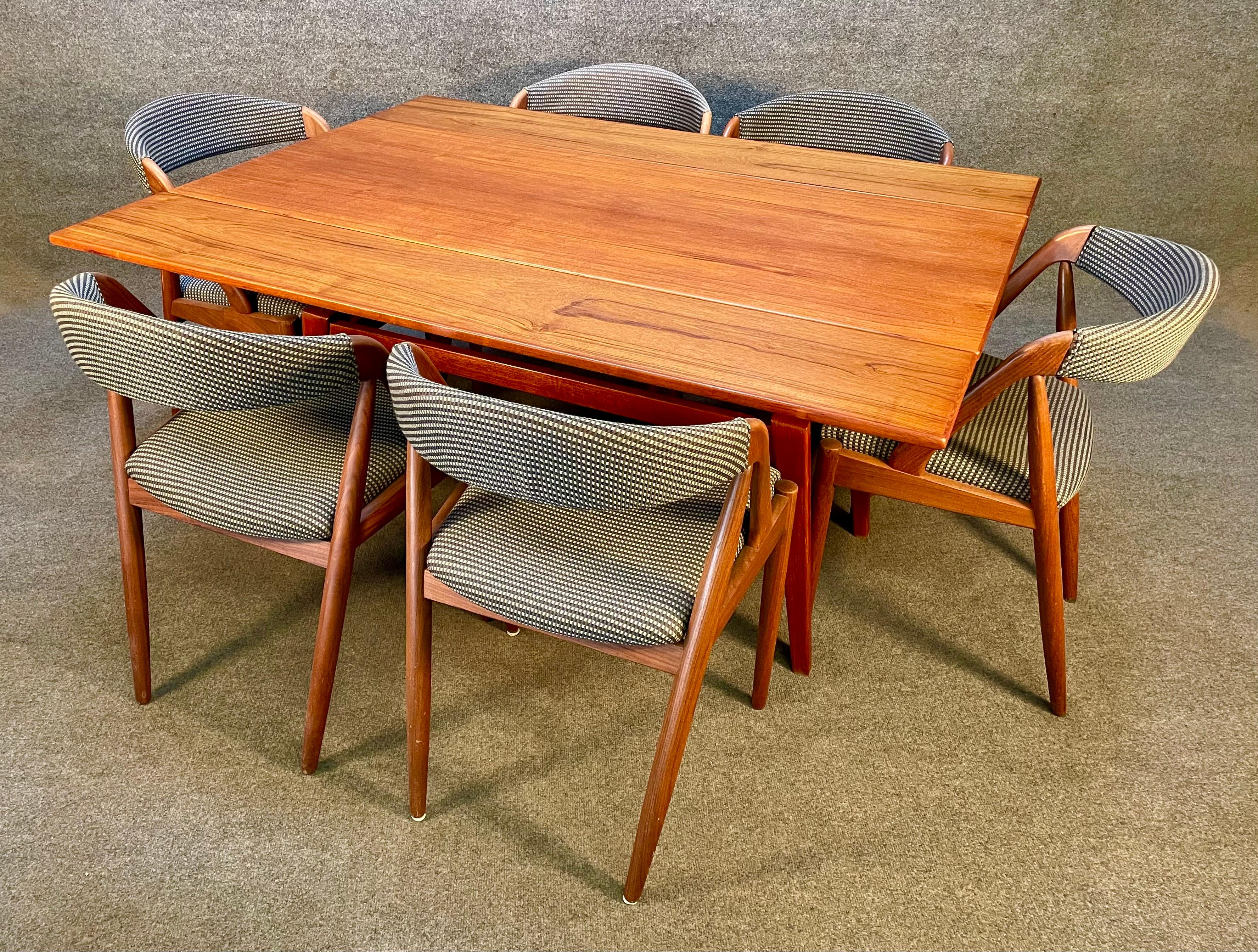 Here is a beautiful scandinavian modern elevator cocktail-dining table in teak manufactured in Denmark in the 1960's.
This clever table, recently imported from Europe to California before its refinishing, features a vibrant wood grain and a lift up