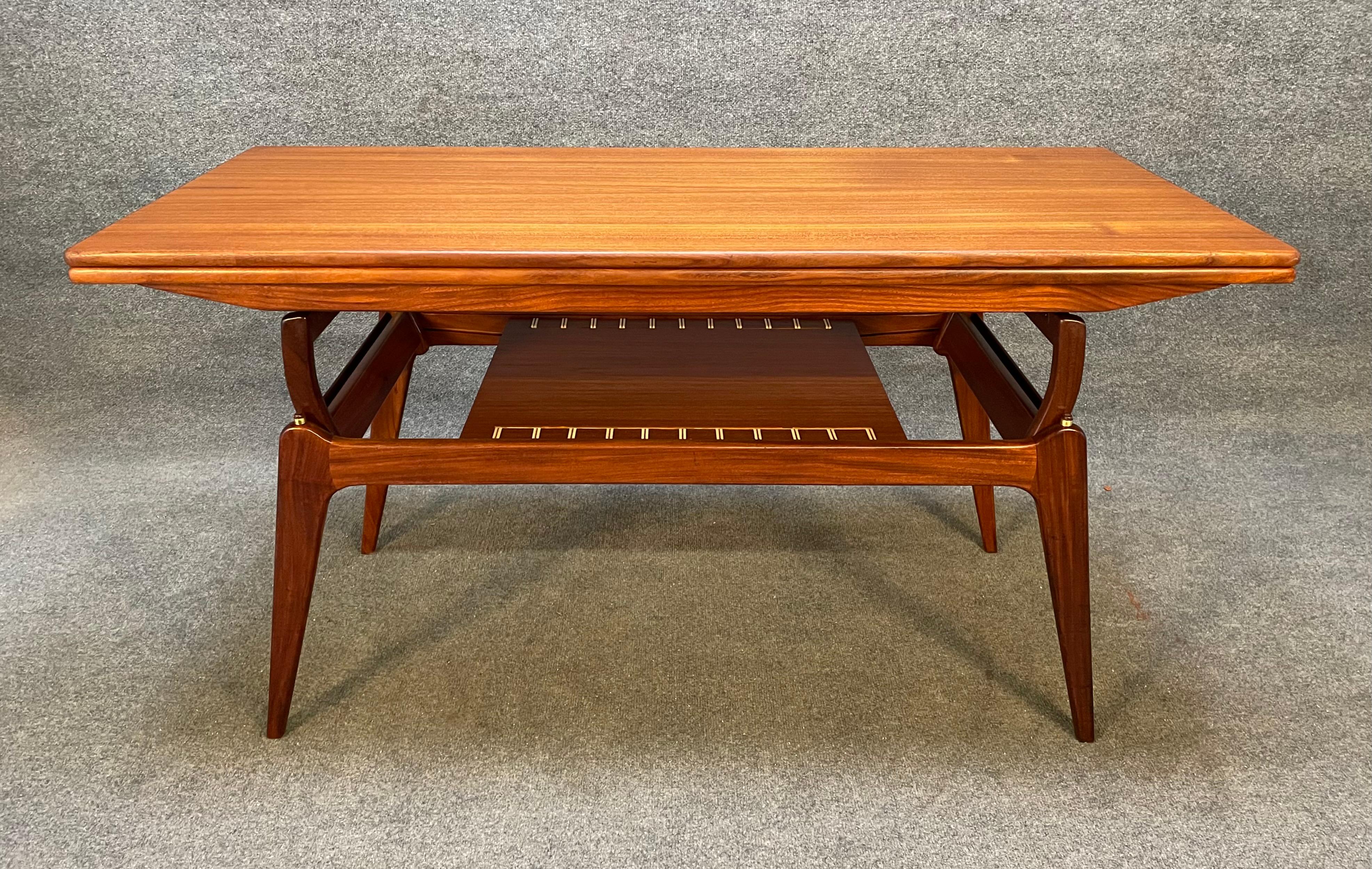 Here is a beautiful scandinavian modern elevator cocktail-dining table in teak manufactured by BC Mobler in Denmark in the 1960's.
This clever table, recently imported from Europe to California before its refinishing, features a vibrant wood grain,