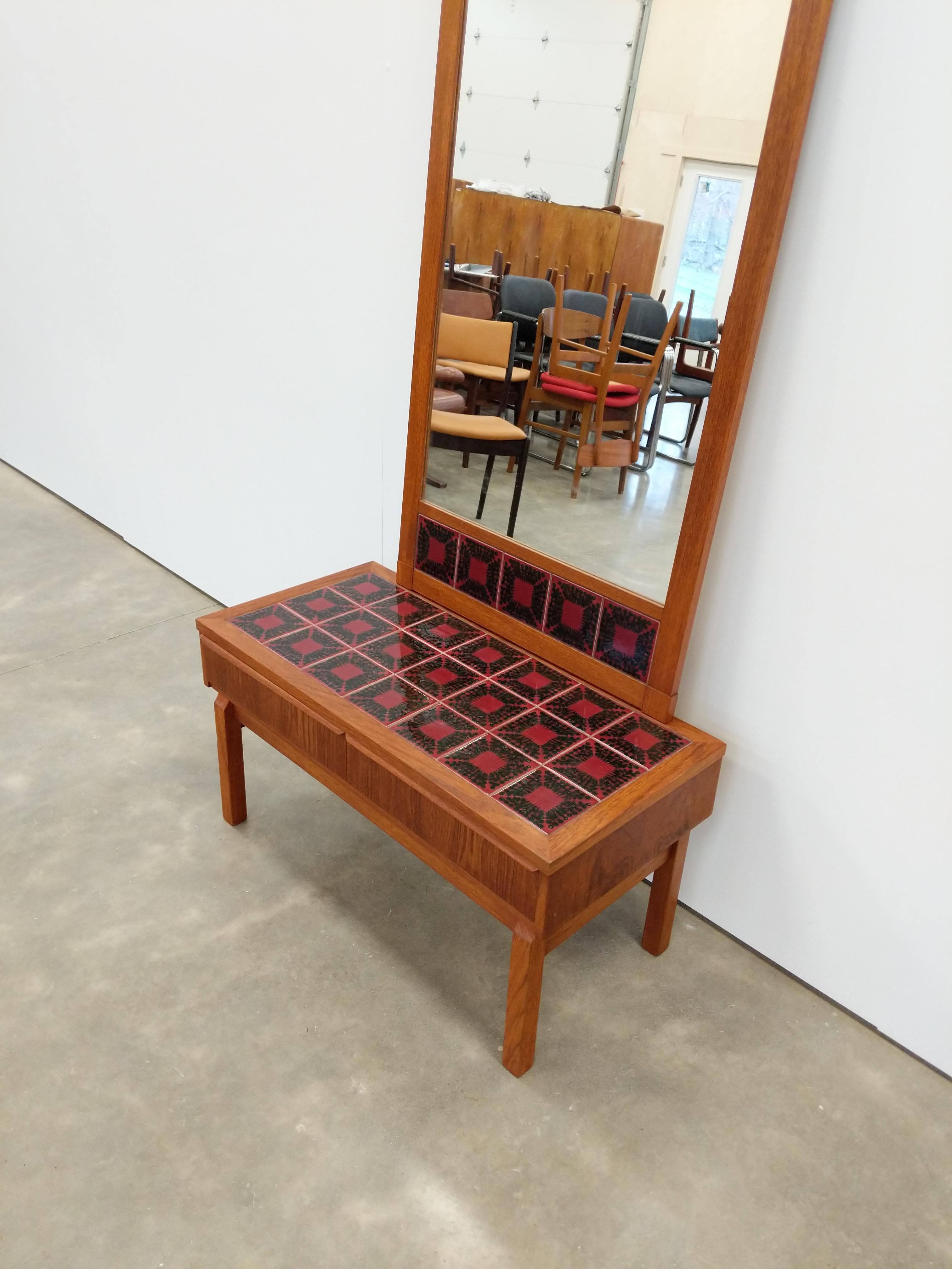 Authentic vintage mid century Danish / Scandinavian Modern teak entry set.

Low chest and mirror with tile.

Mirror hangs on the wall. Mirror is not hung the photos but has hanging hardware on the back.

This set is in excellent refinished condition
