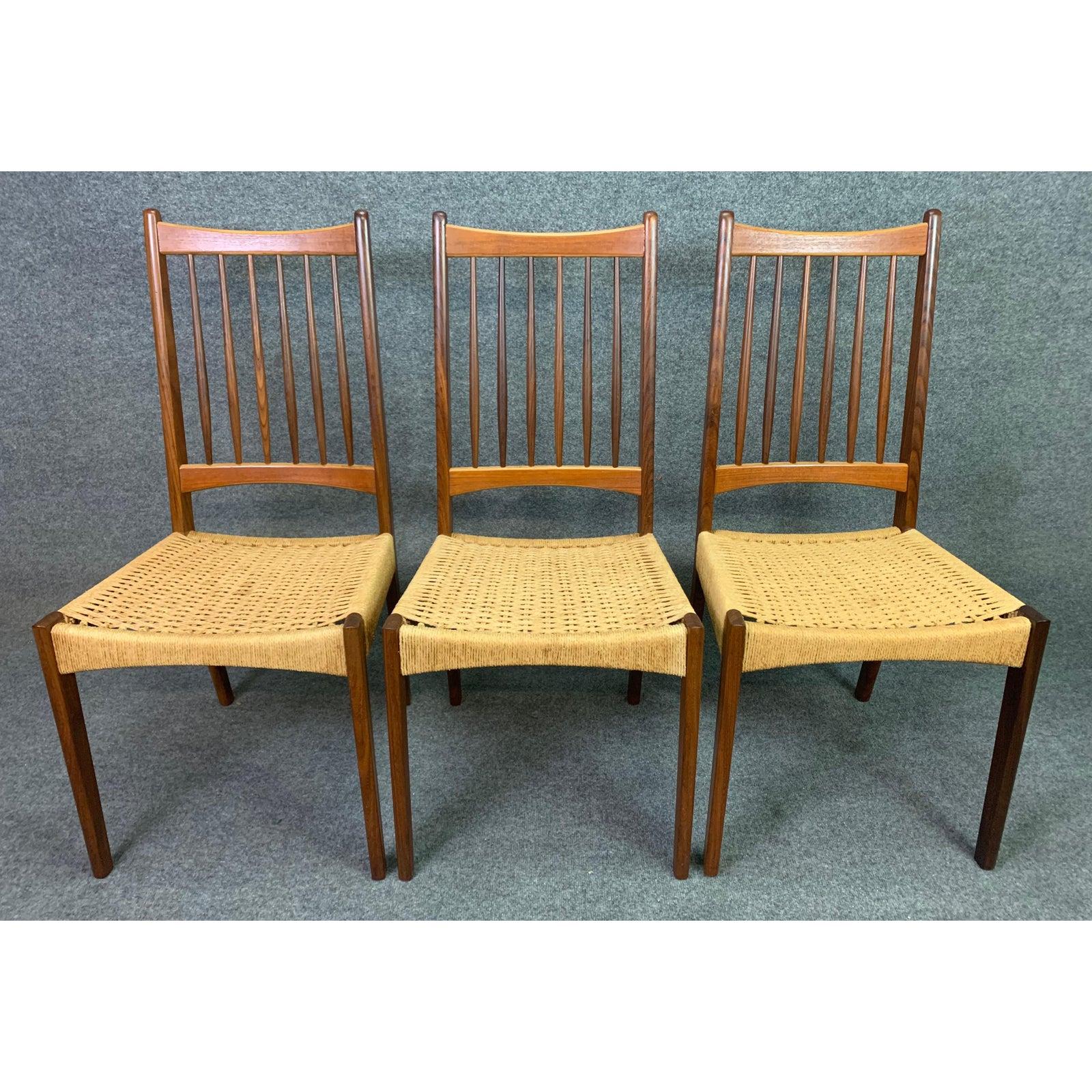 Here is a beautiful set of six 1960s Scandinavian Modern high backs dining chairs in teak manufactured in Denmark.
This comfortable chairs, recently imported from Copenhagen to California, features refinished and sculptural solid teak frames and