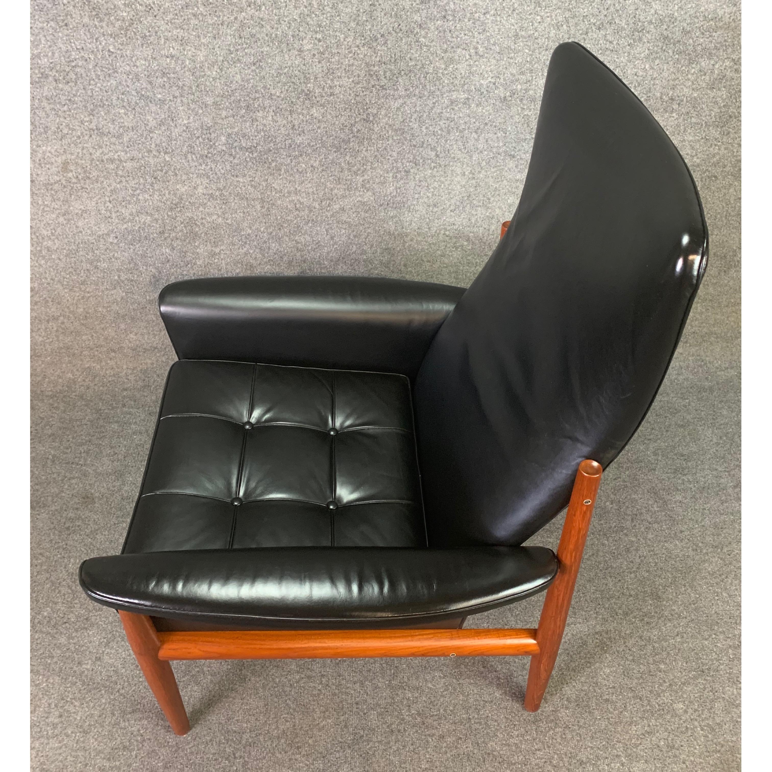 Here is an exclusive 1950's Scandinavian modern high back easy chair, model 