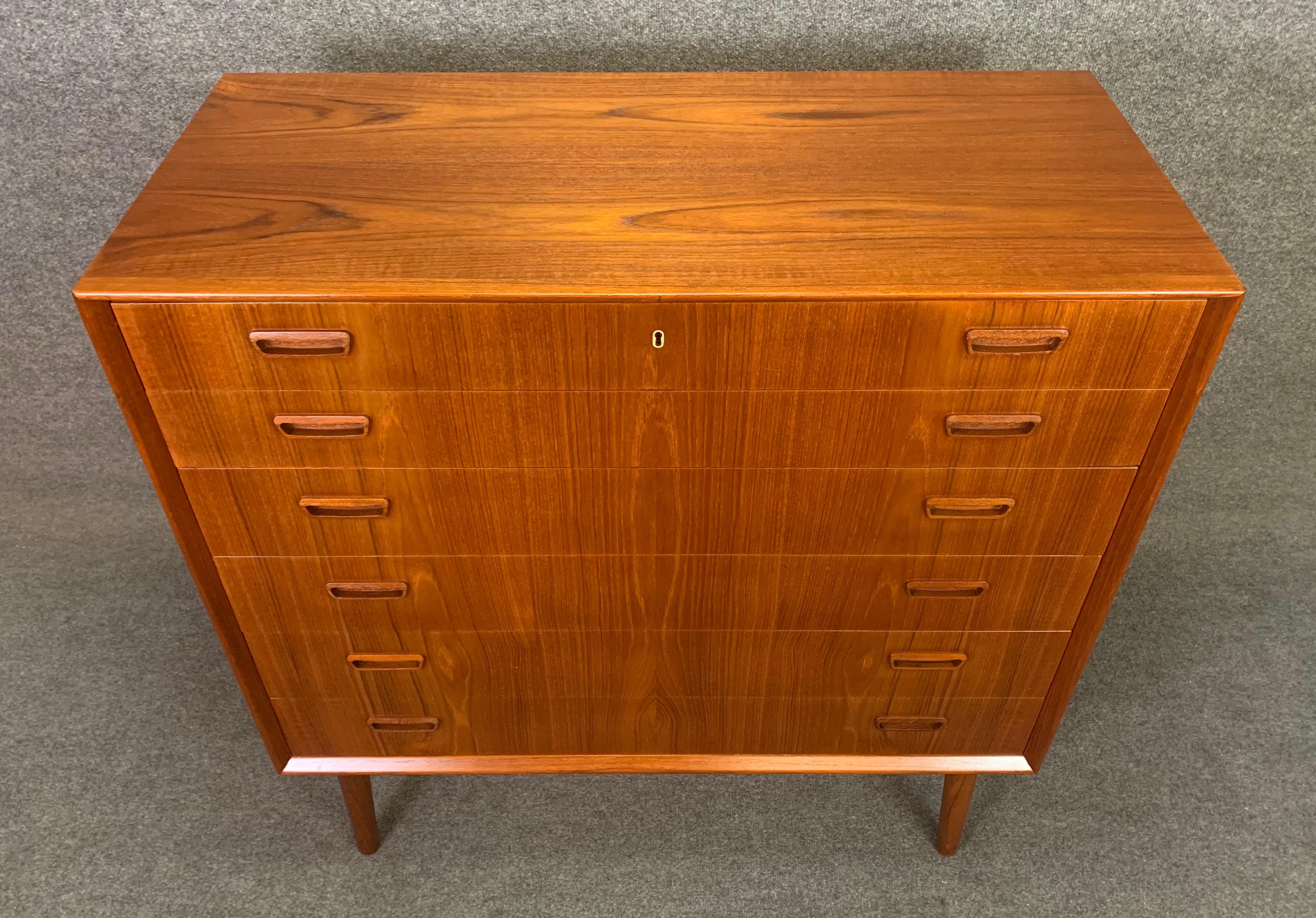 Here is a beautiful Scandinavian Modern teak highboy dresser designed by Borge Seindal and manufactured by P. Westergaards Mobelfabrik in Denmark in the 1960s.
This exquisite case piece, recently imported from Copenhagen to California before it’s