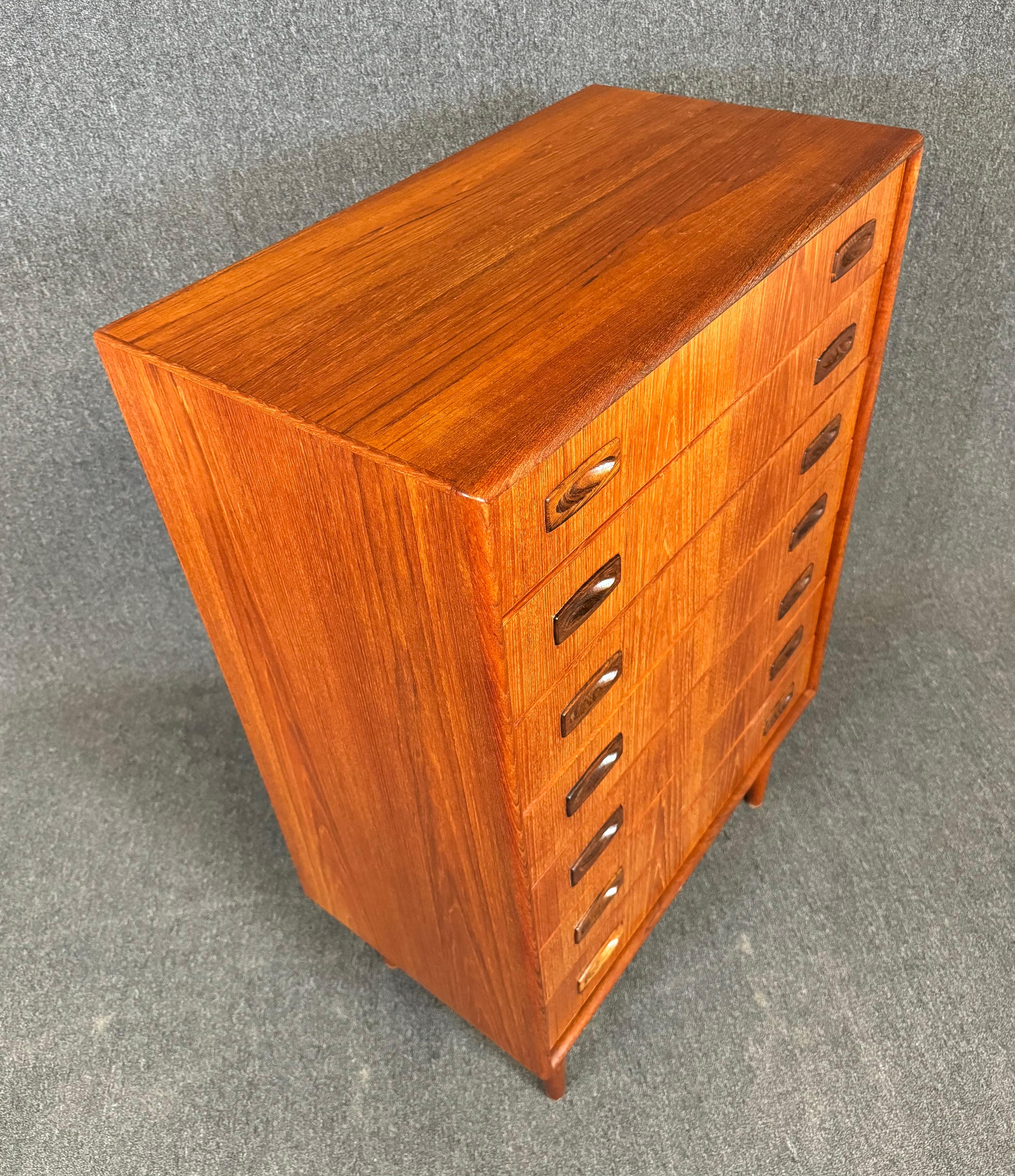Here is a beautiful Scandinavian modern tall boy dresser in teak designed and manufactured by in Denmark in the 1960's.
This lovely case piece, recently imported from Europe to California before its refinishing, features a vibrant wood grain, seven