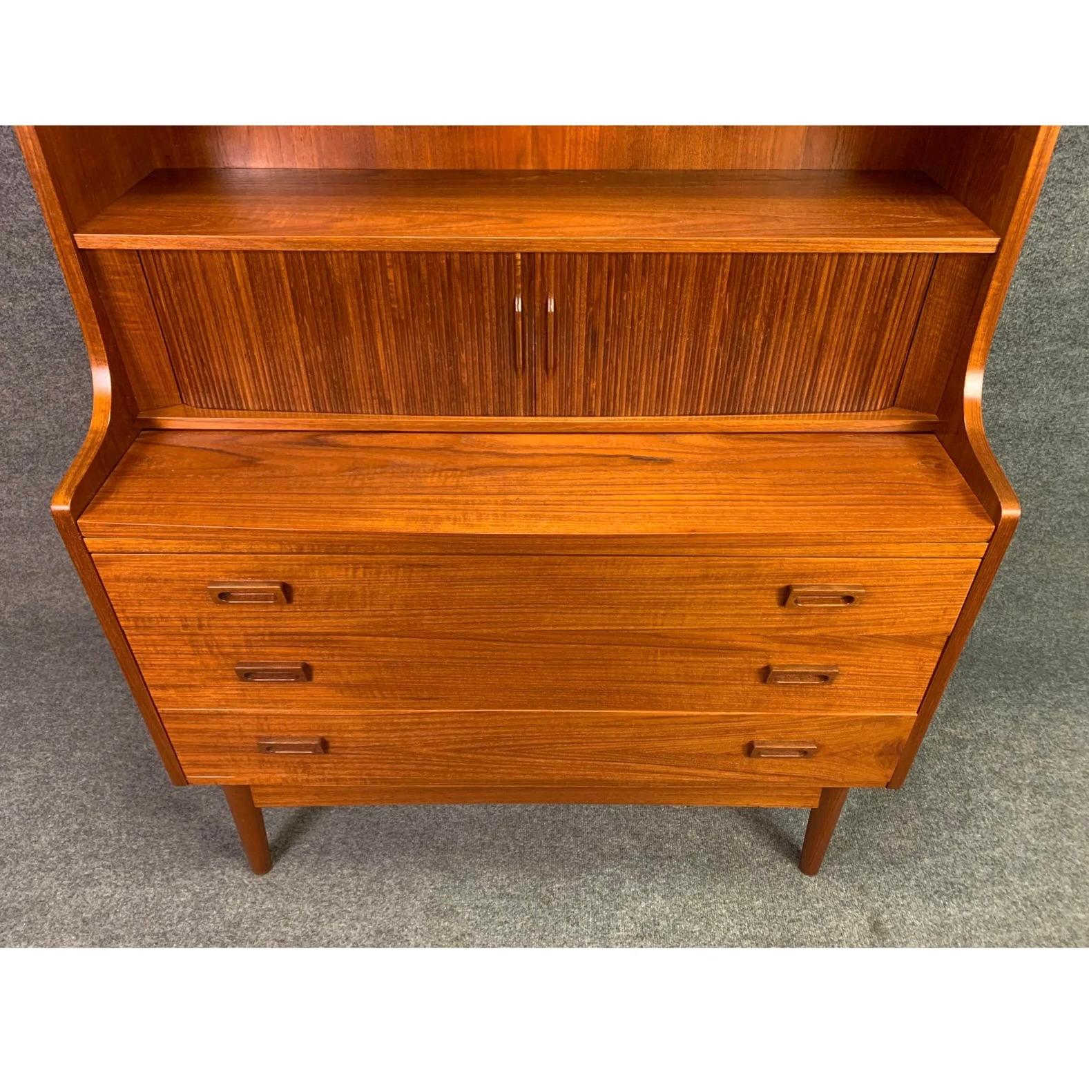Here is a beautiful scandinavian modern secretary-desk-bookcase designed by Johannes Sorth manufactured by Nexxo Mobelfabrik in Denmark in the 1960's.
This exquisite piece, recently imported from Europe to California before its refinishing,