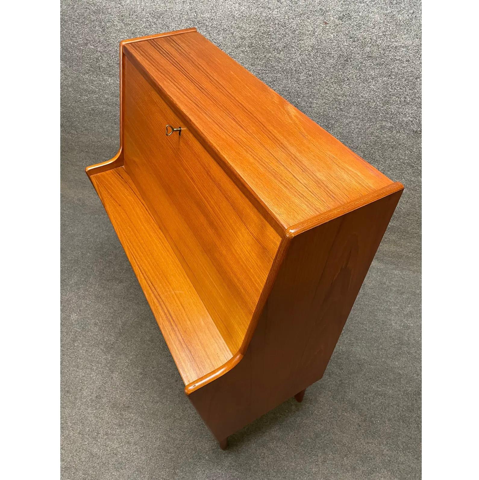 Here is a beautiful and sought after scandinavian modern secretary desk designed by Arne Wahl Iversen and manufactured by Vinde Mobelfabrik in Denmark in the 1960s. This exquisite case piece, recently imported from Europe to California before its