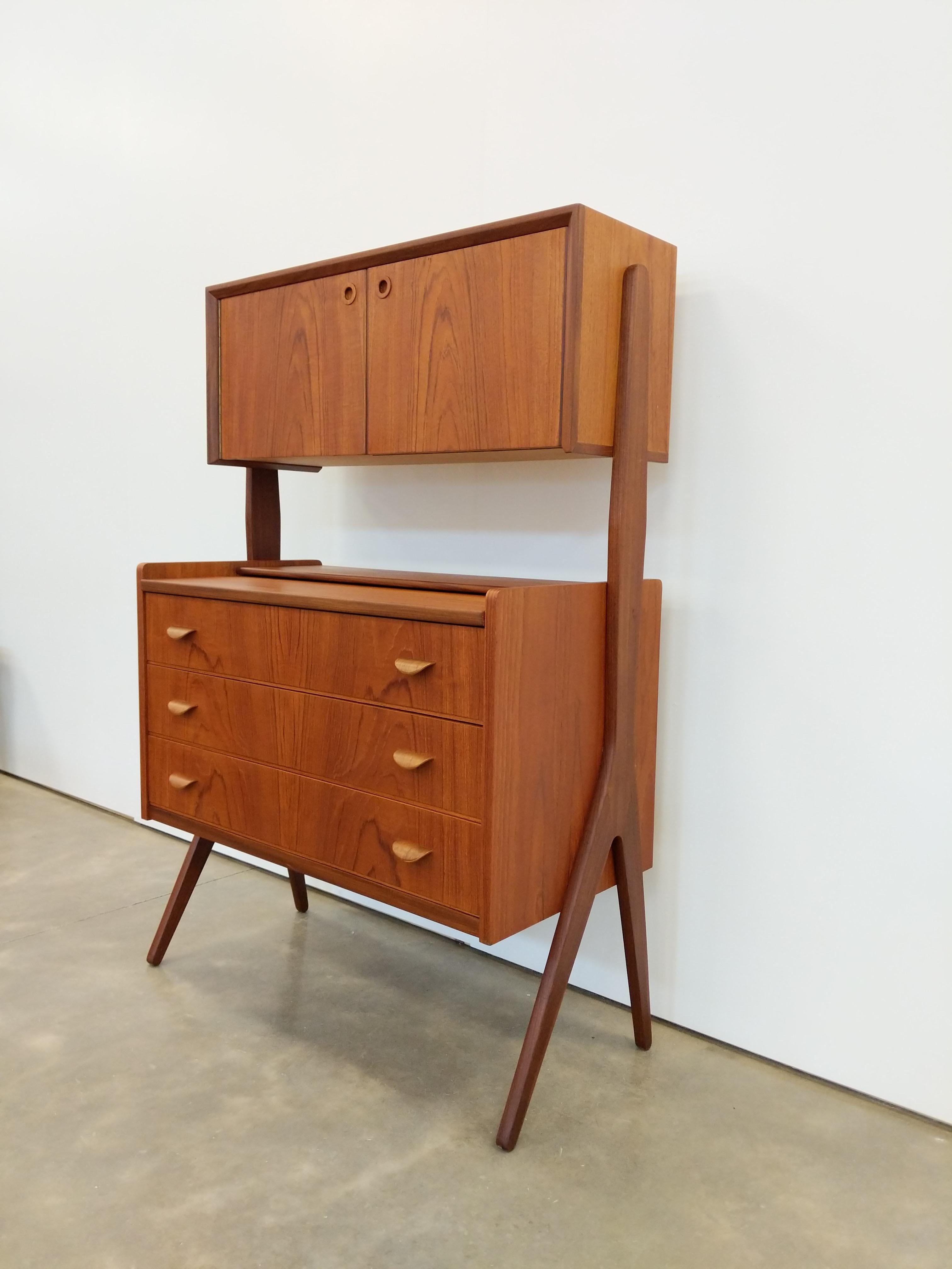 Authentic vintage mid century Danish / Scandinavian Modern teak secretary desk / vanity with mirror / dresser / chest of drawers / cabinet.

This piece is in excellent refinished condition with very few signs of age-related wear (see photos).

If
