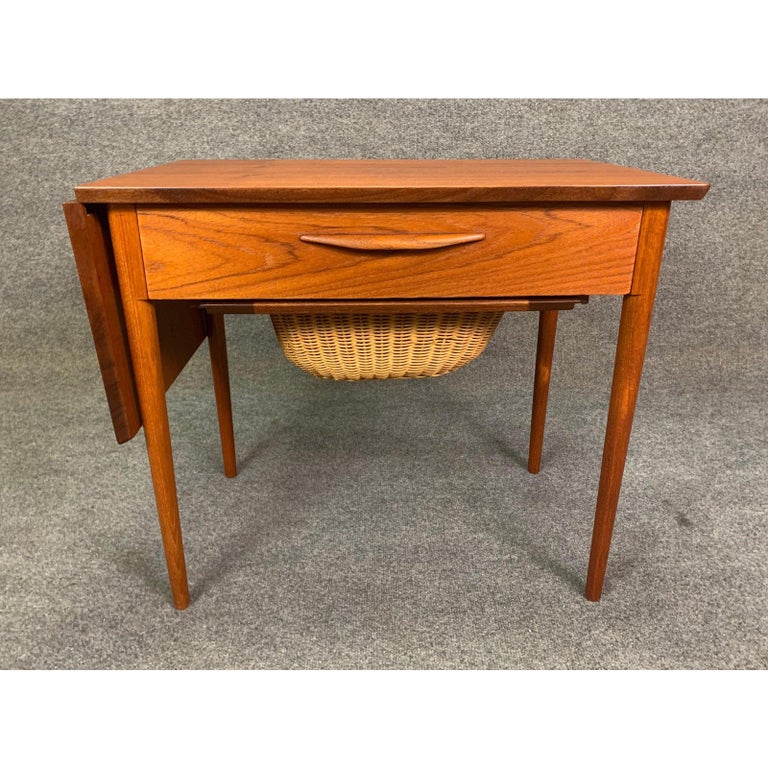 Vintage Danish Mid-Century Modern Teak Sewing Drop Leaf ... Rotating supports prop up the drop leaf panels.