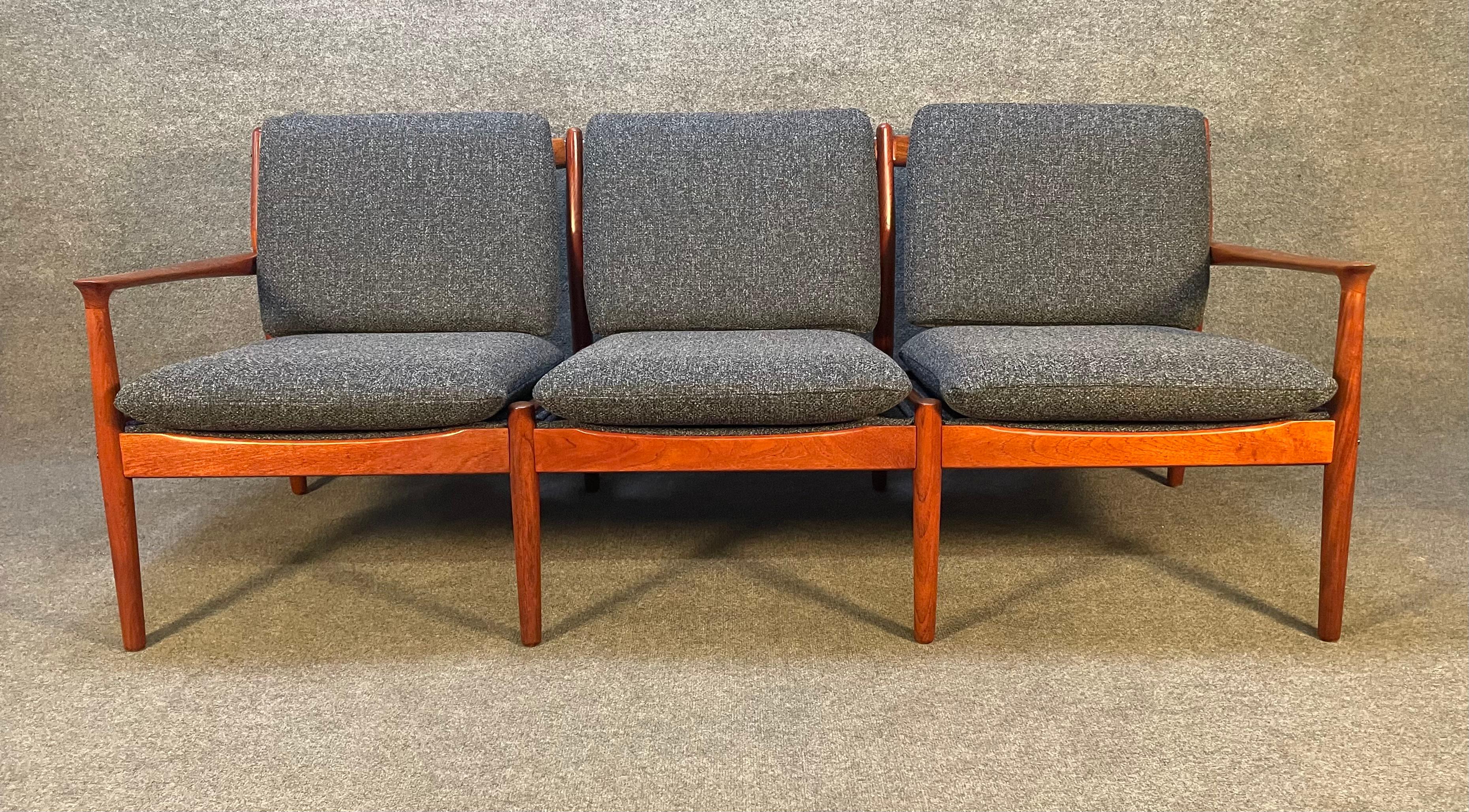 Here is a beautiful Scandinavian modern three seater sofa in teak designed by Svend Aage Eriksen and manufactured by Glostrup Mobelfabrik in Denmark in the 1960's.
This comfortable couch, recently imported from Europe to California before its