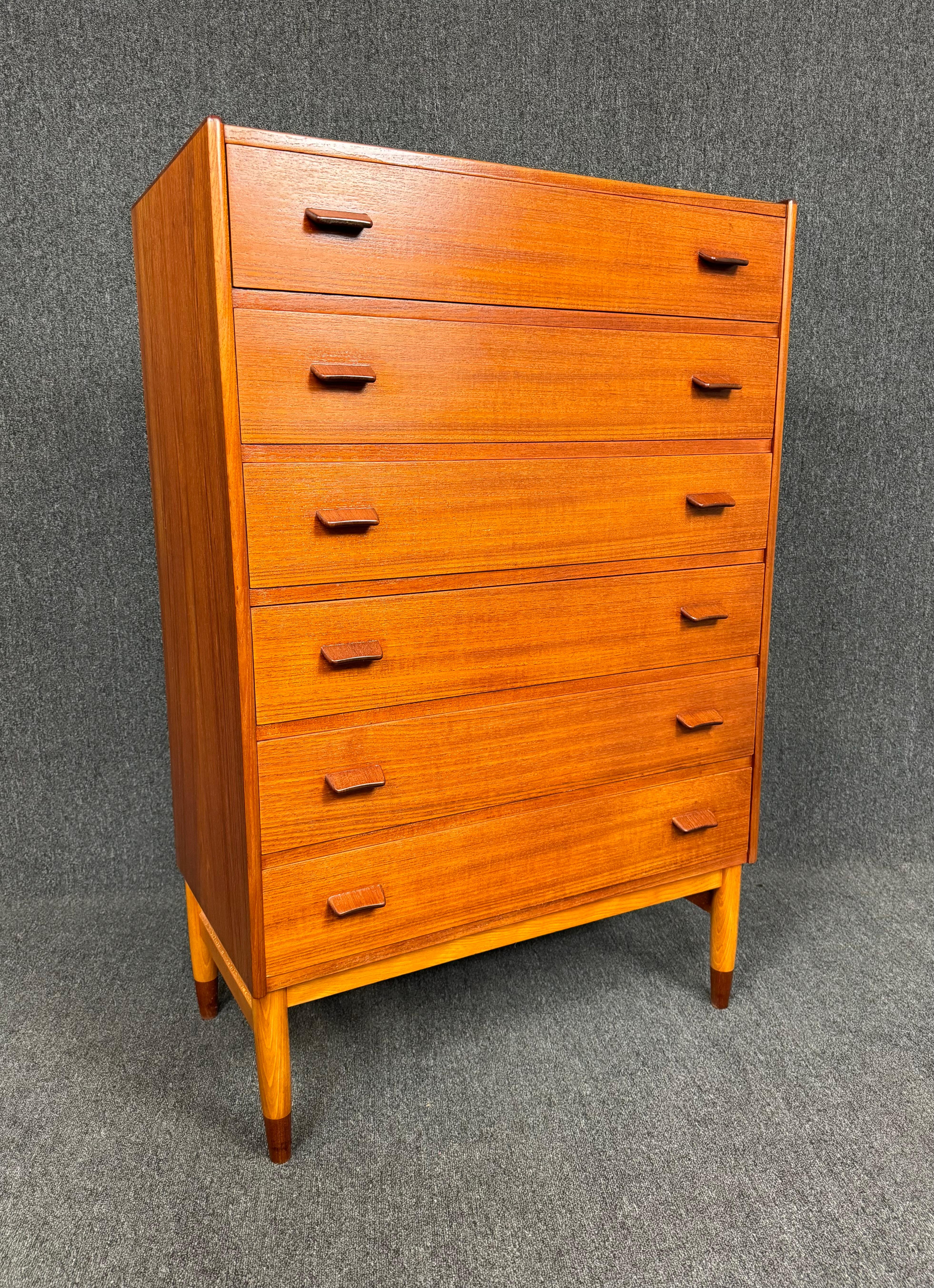 Here is a beautiful Scandinavian modern tall boy dresser in teak designed by Poul Volther and manufactured by FDB Mobler in Denmark in the 1960's.
This lovely case piece, recently imported from Europe to California before its refinishing, features a