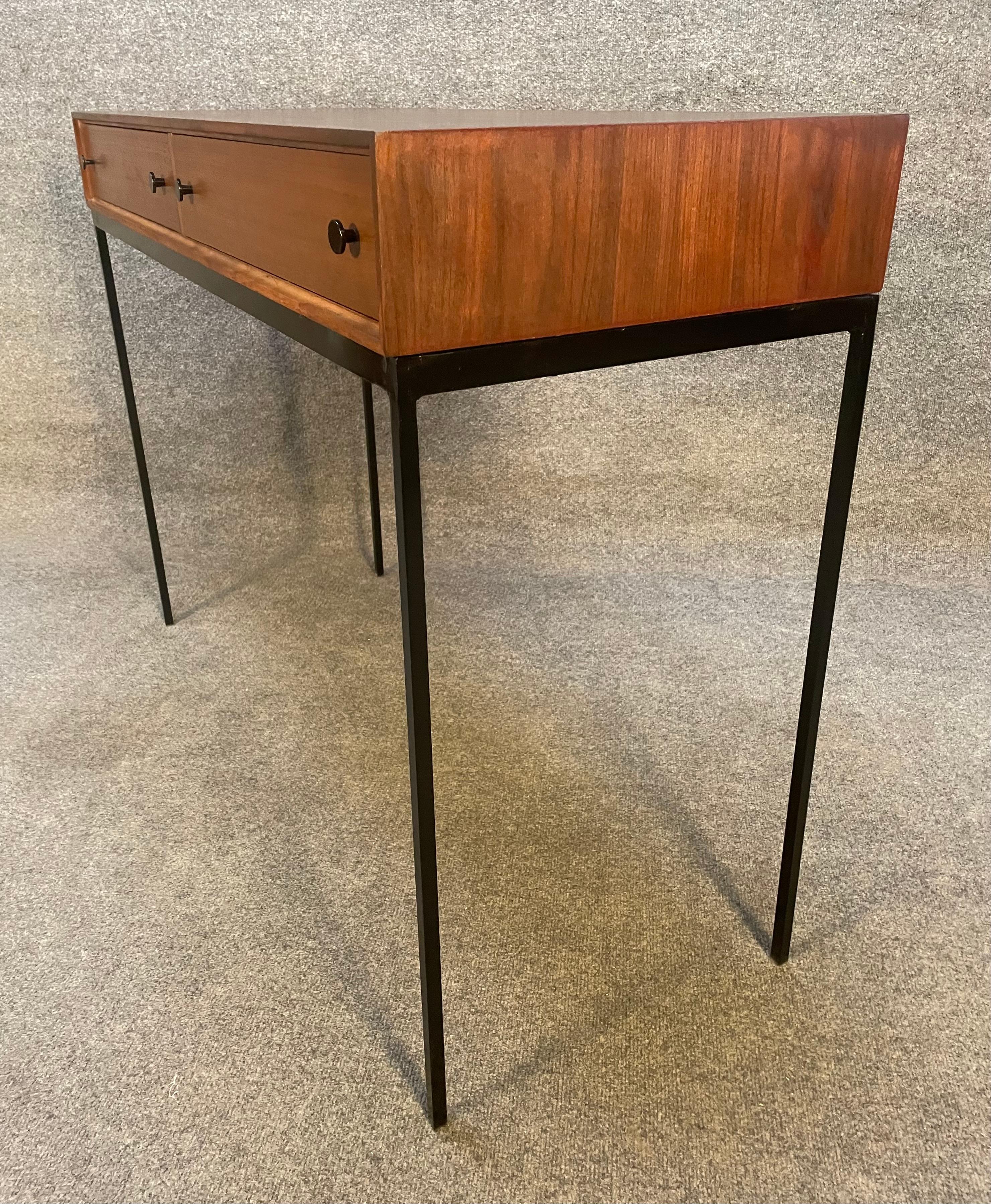 Here is a beautiful scandinavian modern entry way console in walnut designed by Poul Norreklit and manufactured in Sweden in the 1960's.
This lovely case piece, recently imported from Europe to California before its restoration, features a vibrant