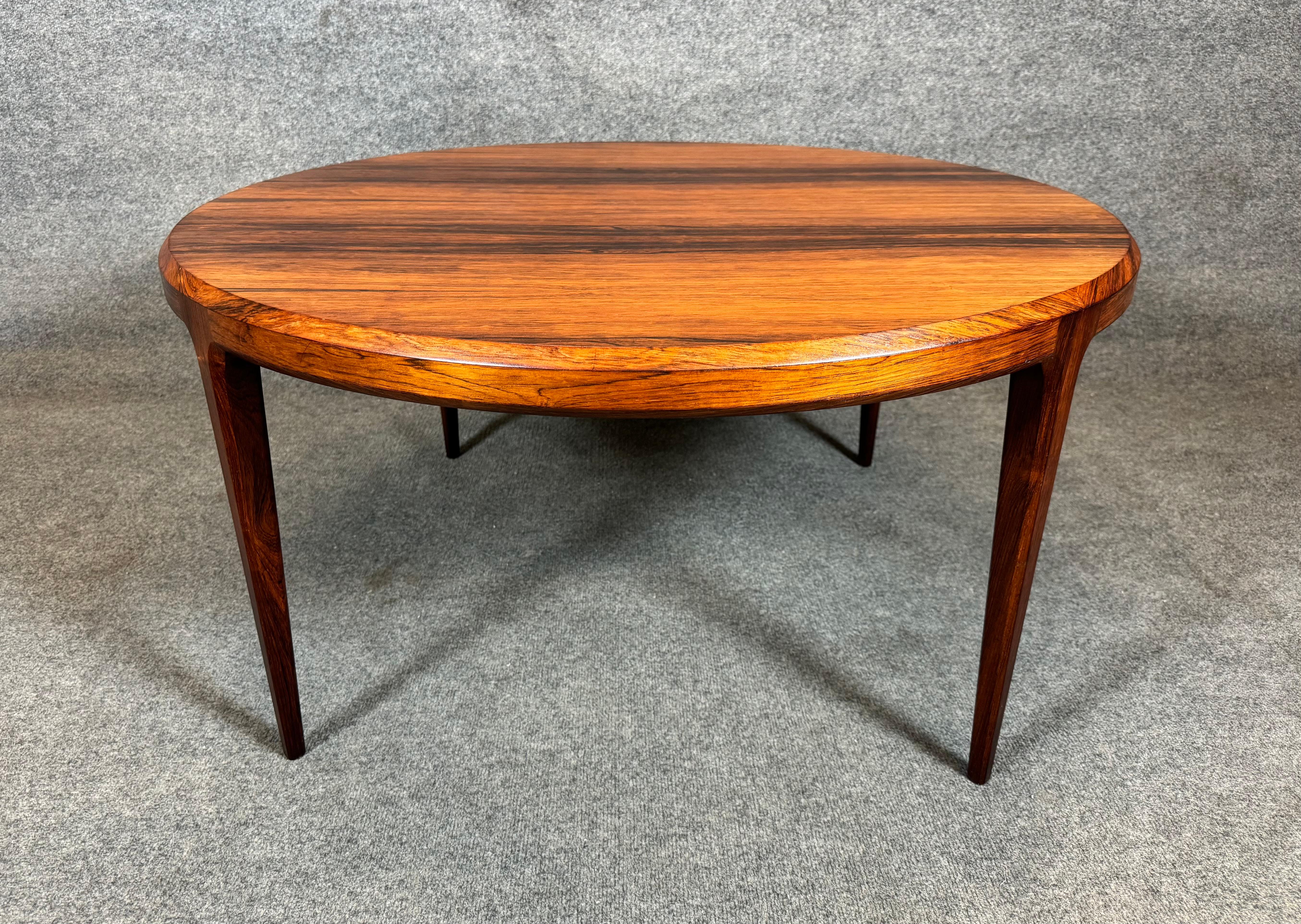 Here is a beautiful Scandinavian modern coffee table in Brazilian rosewood designed by Johannes Andersen and manufactured by CFC Mobelfabrik in Denmark in the 1960's.
This lovely round shaped table, recently imported from Europe to California before