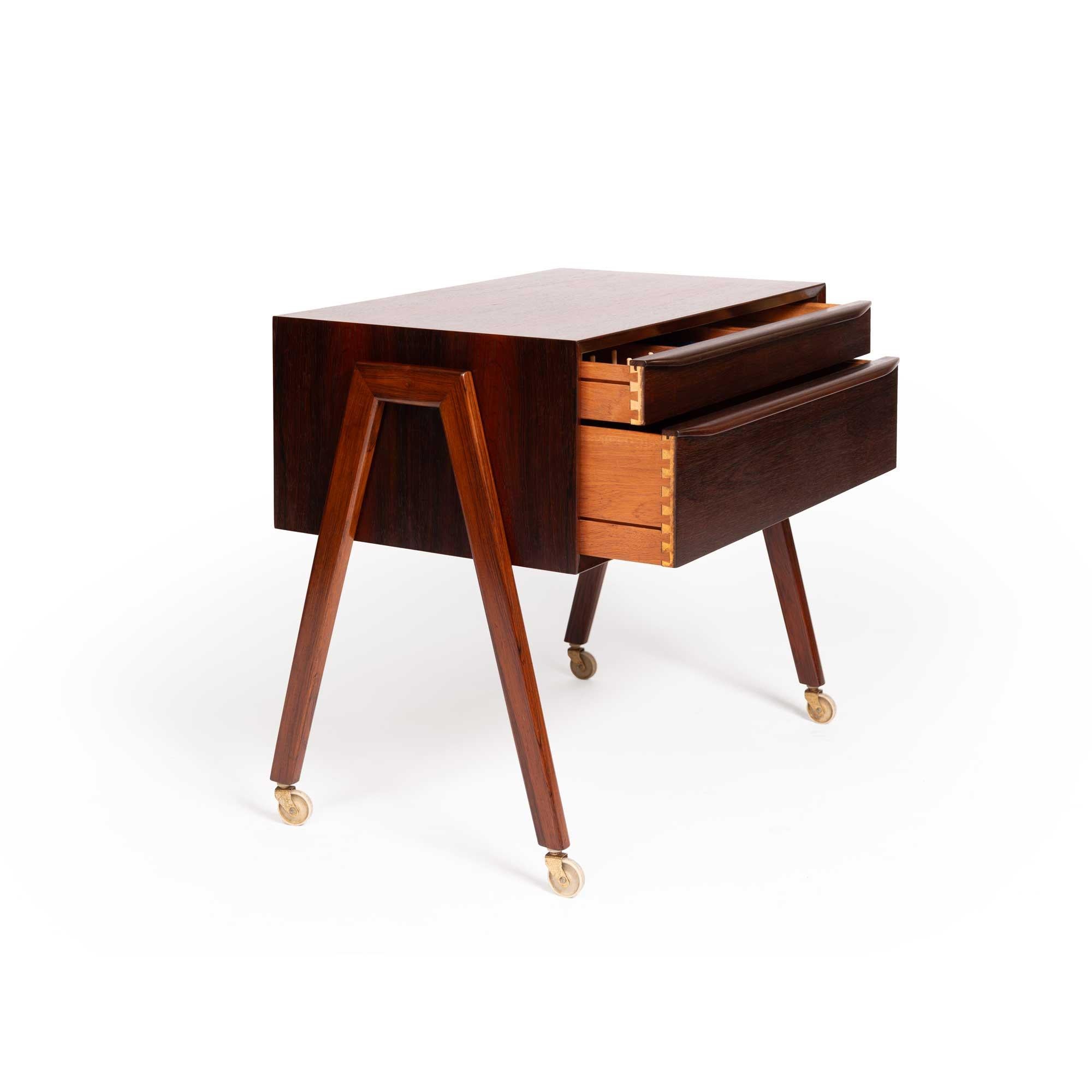 This beautifully crafted rosewood chest, originally designed as a sewing cabinet, offers exceptional versatility and timeless style. Its exquisite construction and rich wood grain make it a striking addition to any space, whether you use it as a