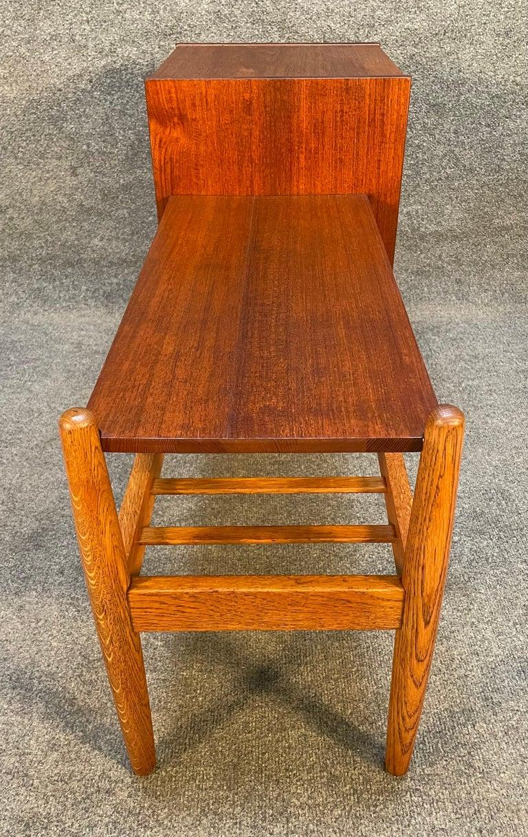 Here is a beautiful scandinavian modern entry way - side table designed by Arne Wahl Iversen in teak and oak manufactured in Sweden in the 1960's by Ikea. This exquisite piece, recently imported from Europe to California before its refinishing,