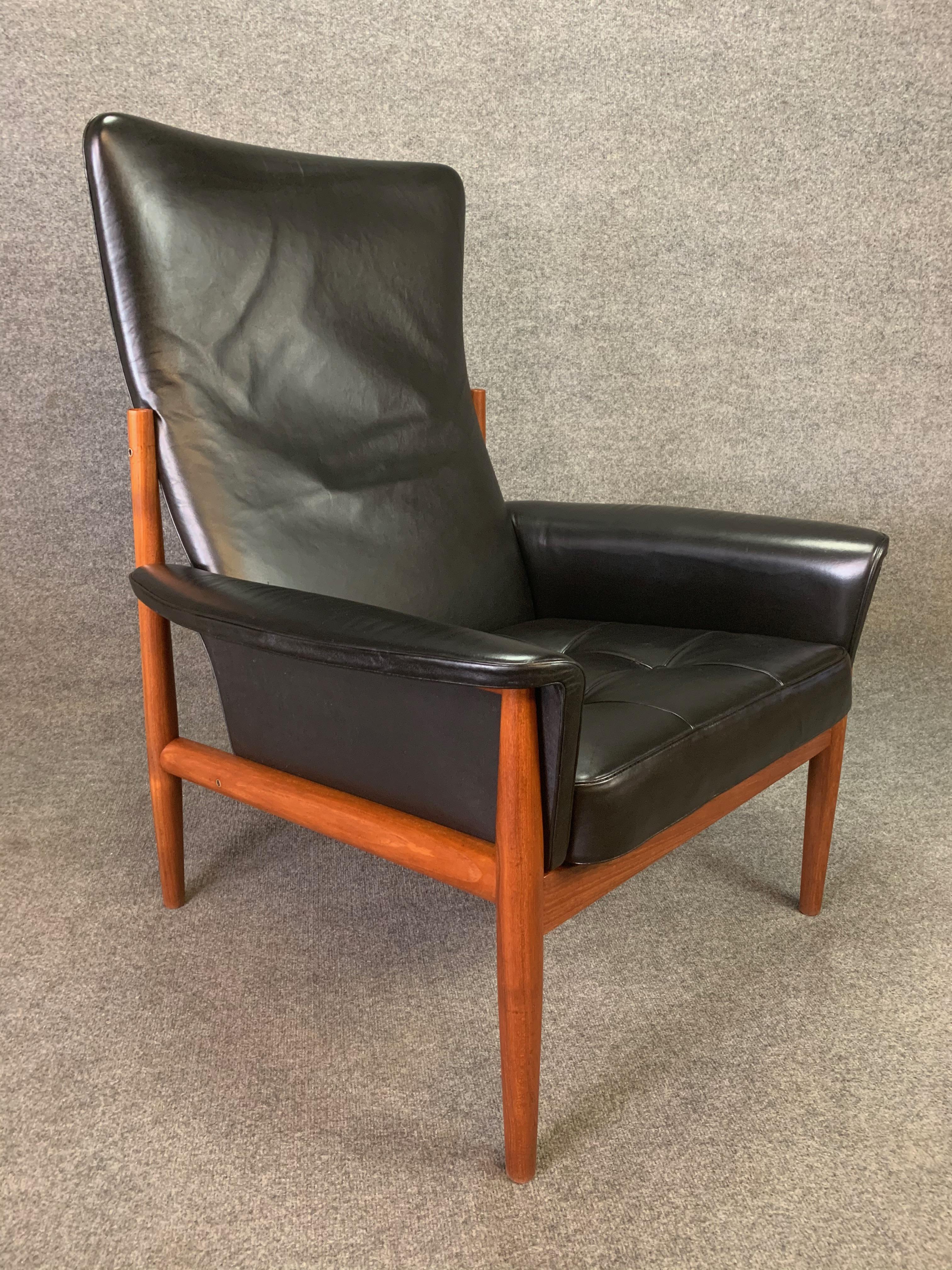 Here is an exclusive 1950s Scandinavian Modern high back easy chair, model 