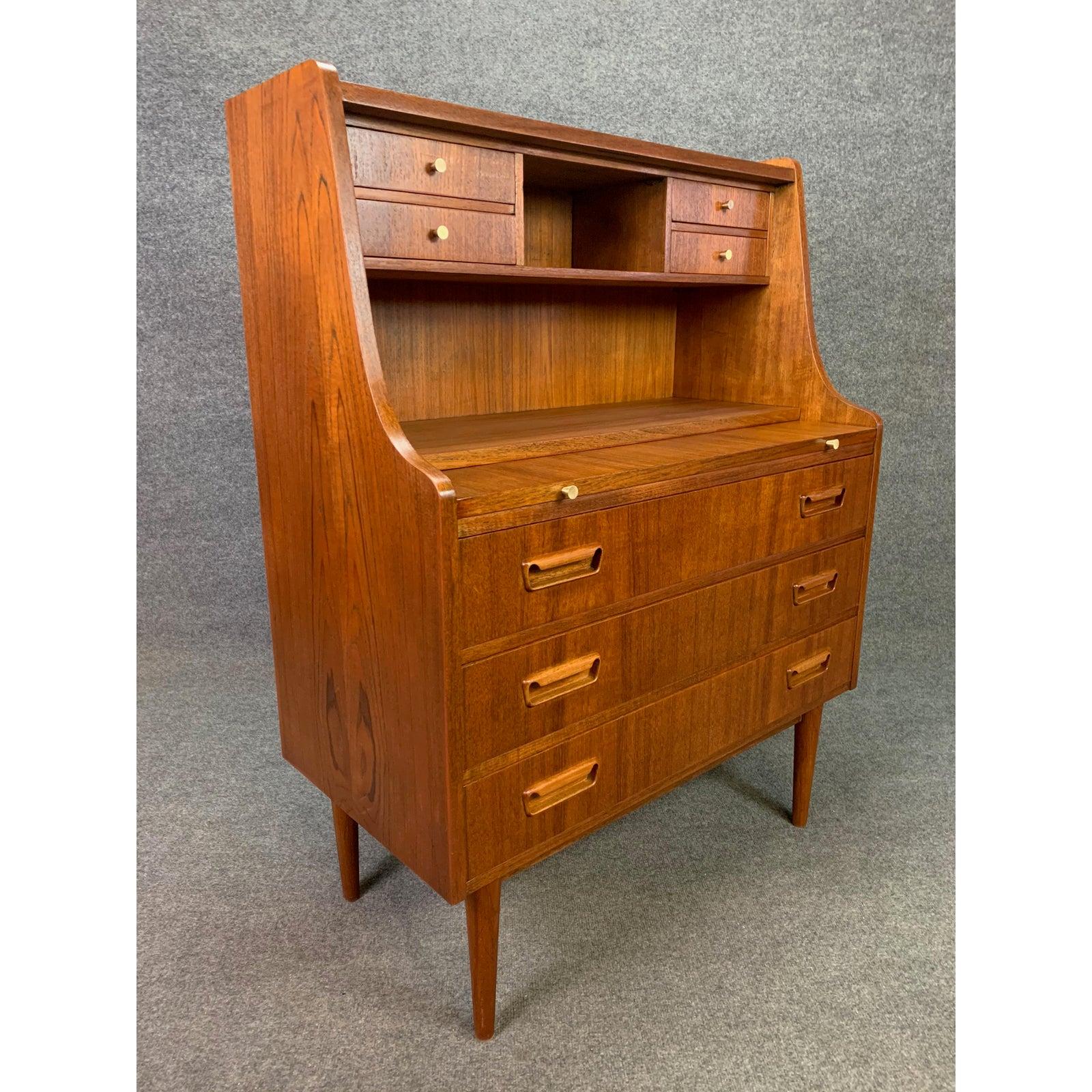 Here is a beautiful Scandinavian Modern teak secretary desk designed by Gunnar Nielsen Tibergaard in Denmark in the 1960s.
This special piece, recently imported from Copenhagen to California before its refinishing, features a vibrant teak grain,