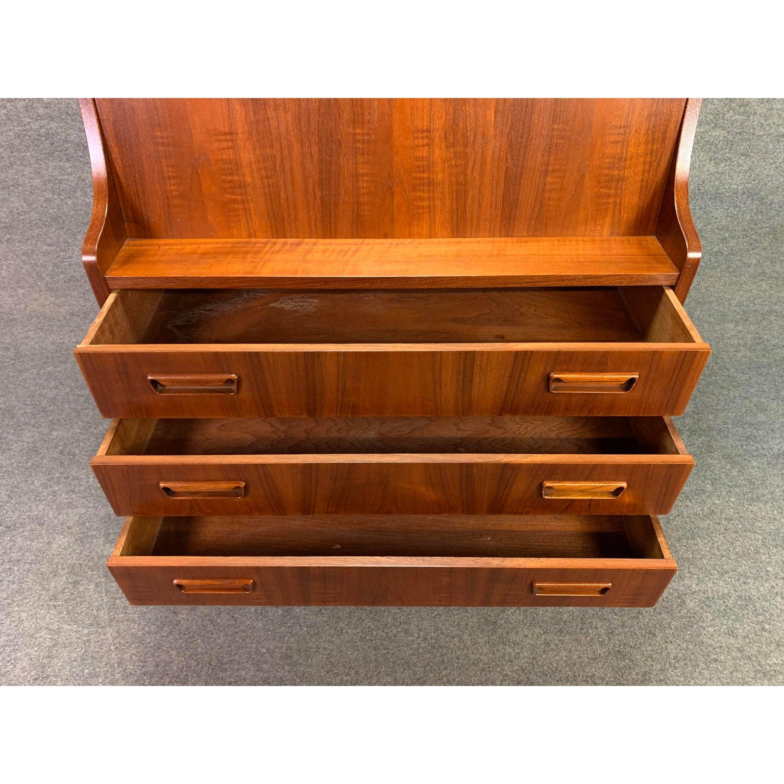 Here is a beautiful Scandinavian Modern secretary desk in teak wood designed by Gunner Nielsen Tibergaard in the 1960 and manufactured in Denmark. This exquisite piece, recently imported from Copenhagen to California before is restoration, features