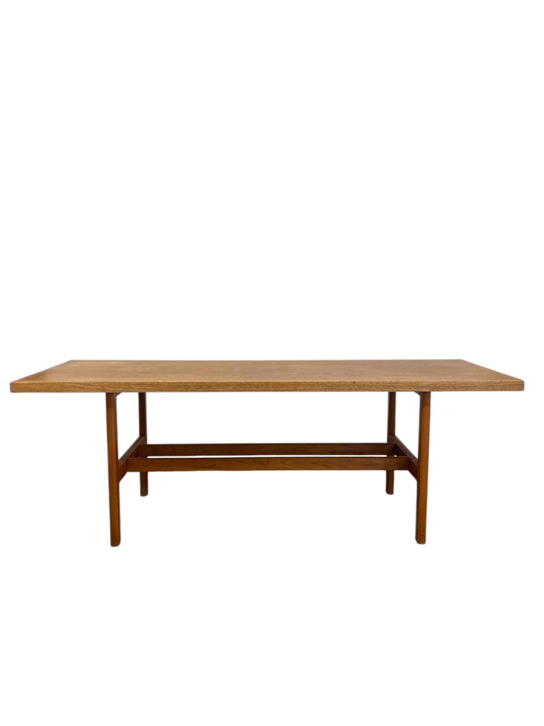 This vintage Danish mid-century modern coffee table, attributed to Berge Mogensen, exemplifies the refined craftsmanship and minimalist sensibility of Scandinavian design.Constructed from solid white oak, the table features a rectangular top with