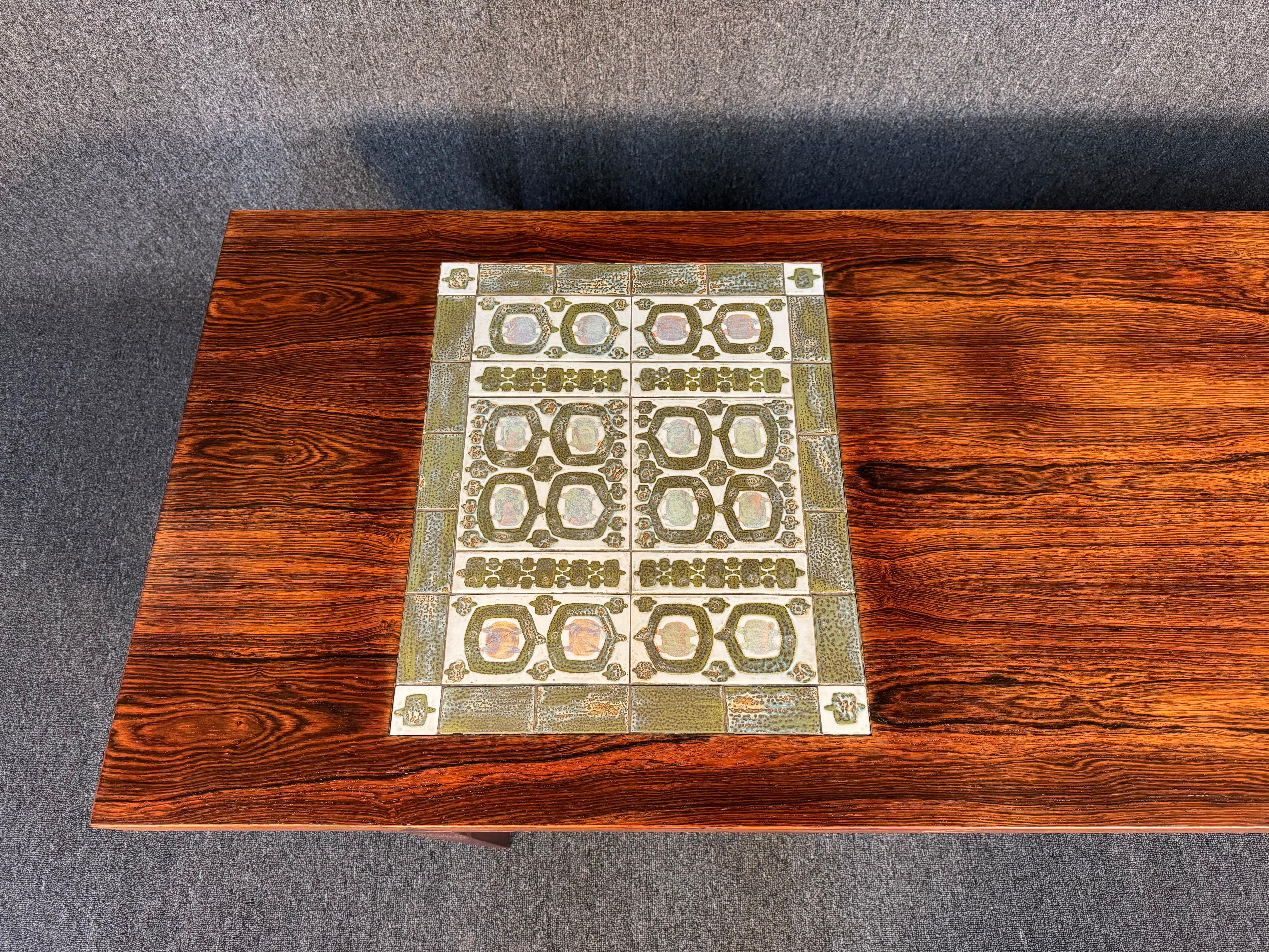 Here is a beautiful scandinavian modern cocktail table in rosewood with ceramic tile insert designed by Severin Hansen and manufactured by Haslev Mobelfabrik in Denmark in the 1960's.
This lovely coffee table, recently imported from Europe to
