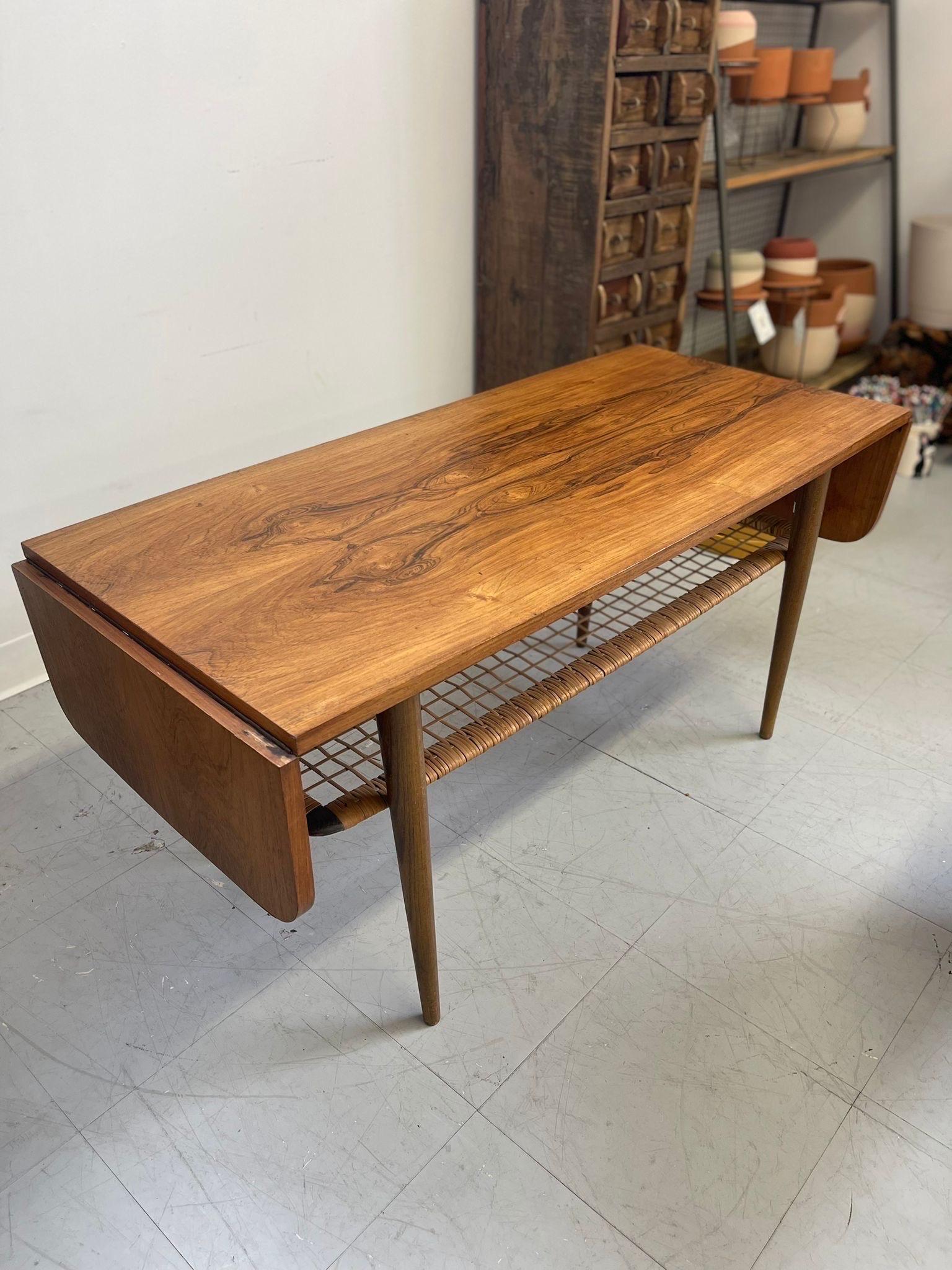 Mid-Century Modern Vintage Danish Modern Coffee Table With Ornate Rosewood Grain and Wicker Shelf For Sale