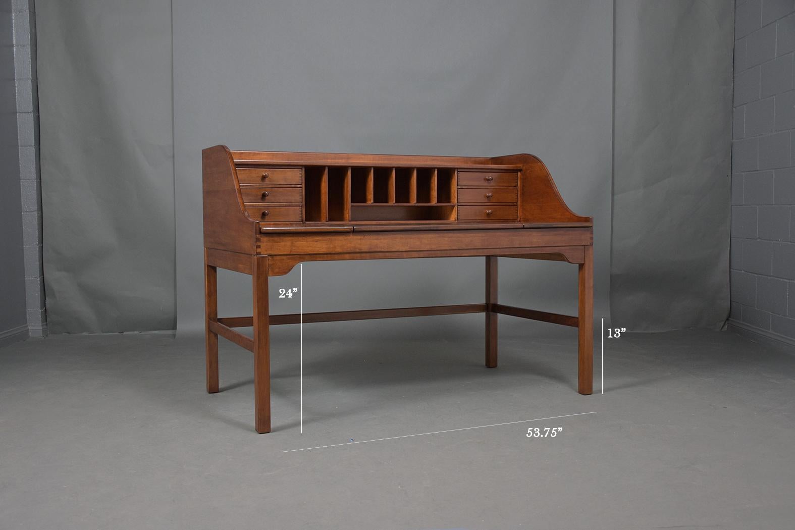 An extraordinary modern danish architect desk beautifully crafted out of teak wood professionally restored and newly lacquered and polished by our craftsmen team. This beautiful piece features a walnut color patina finish, top gallery molding, six