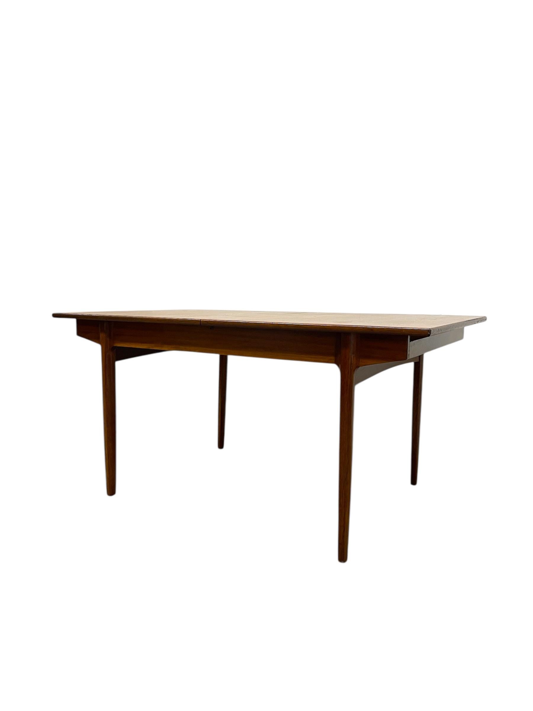 Wood Vintage Danish Modern Expanding Dining Table with Self-storing Leaf For Sale