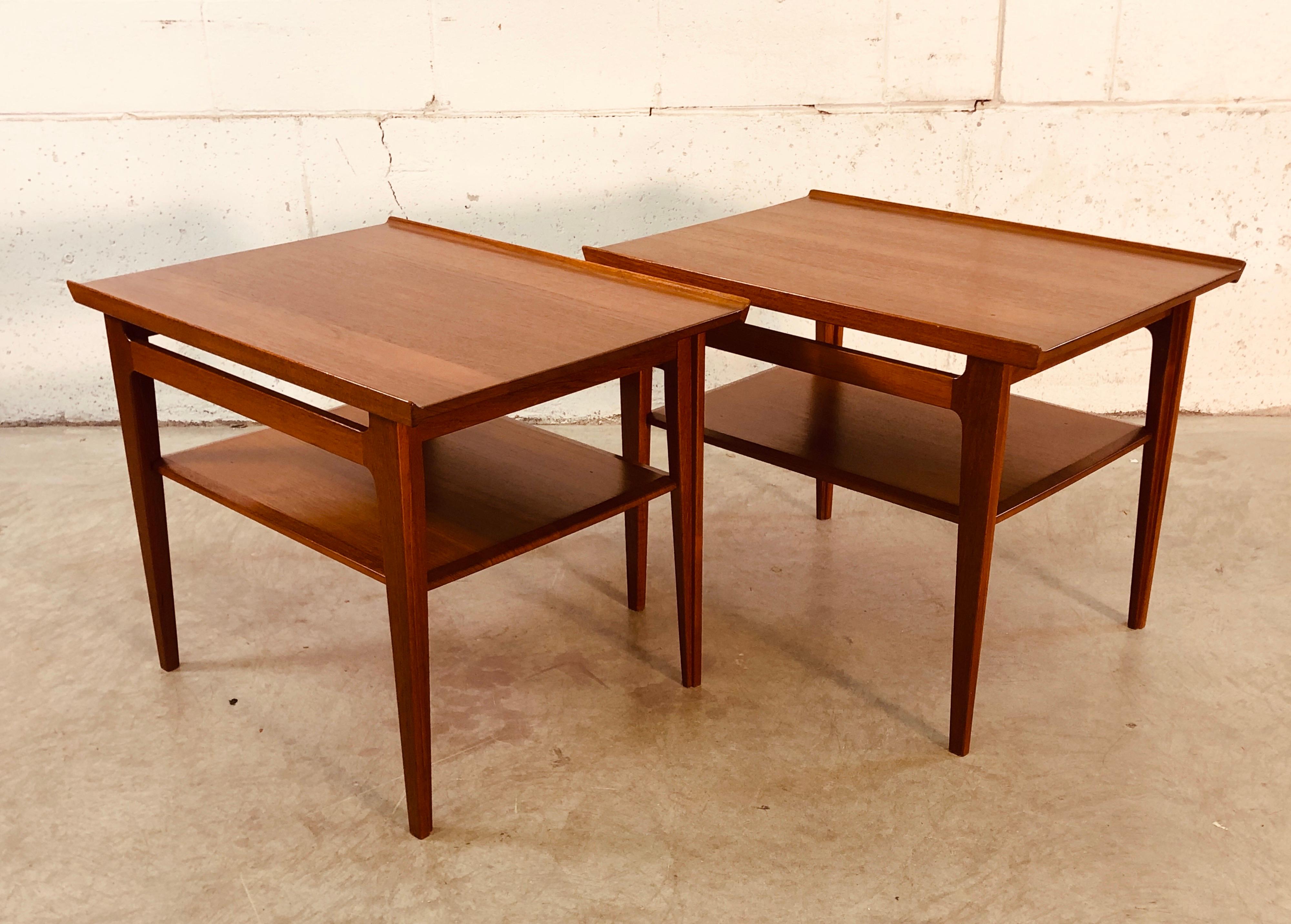 Vintage Danish modern pair of solid teak side tables designed by Finn Juhl for France & Sons, 1950s. These tables are from the 500 series. They are in very good condition with a couple of spots on the top of the tables. The tables are sturdy and in