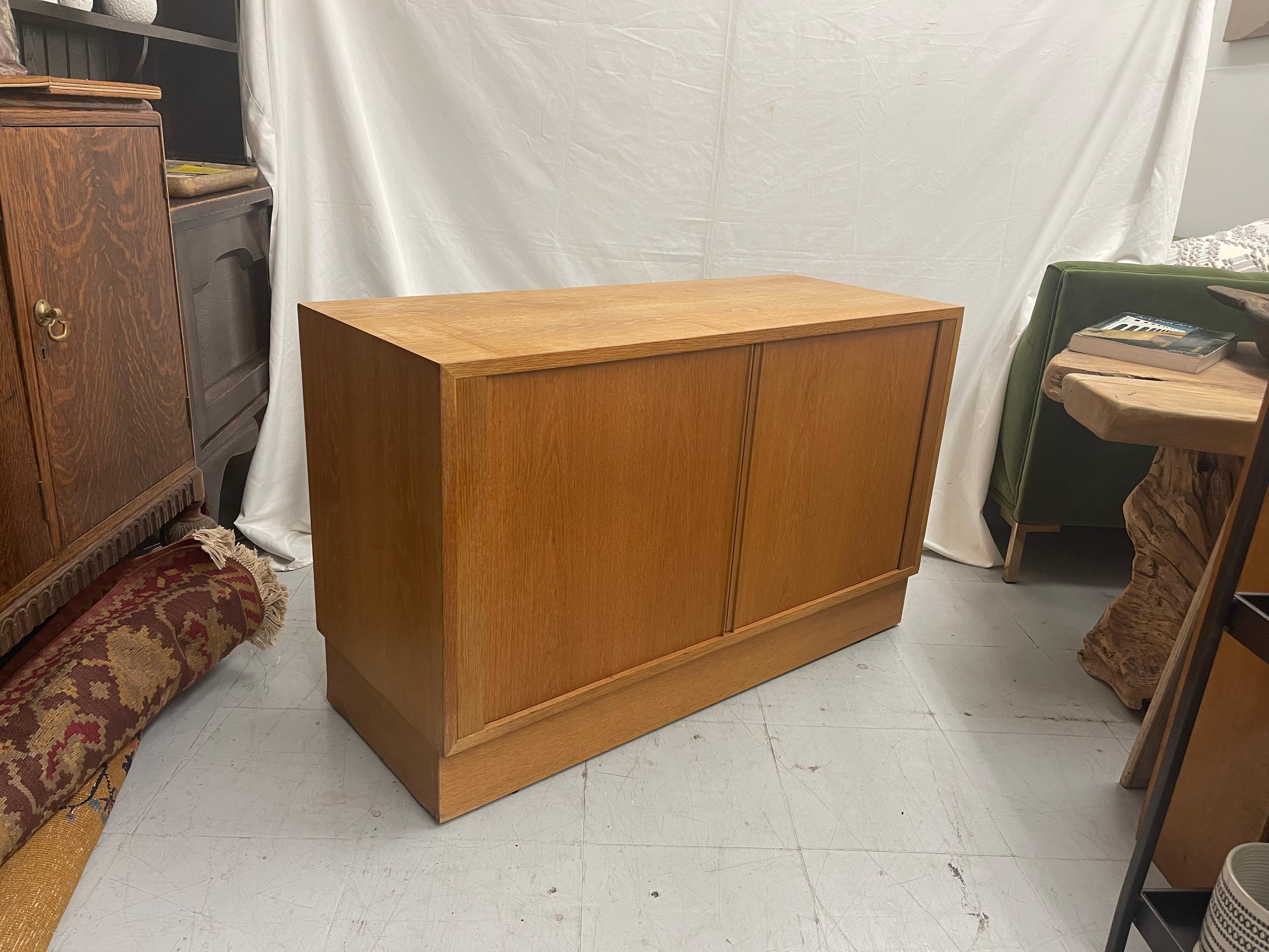 Magnificent Danish design credenza record cabinet. This furniture can be used as a credenza or record cabinet and is made from oak and the shelves are removable. The credenza is of high quality and in nice vintage condition.

Left Compartment