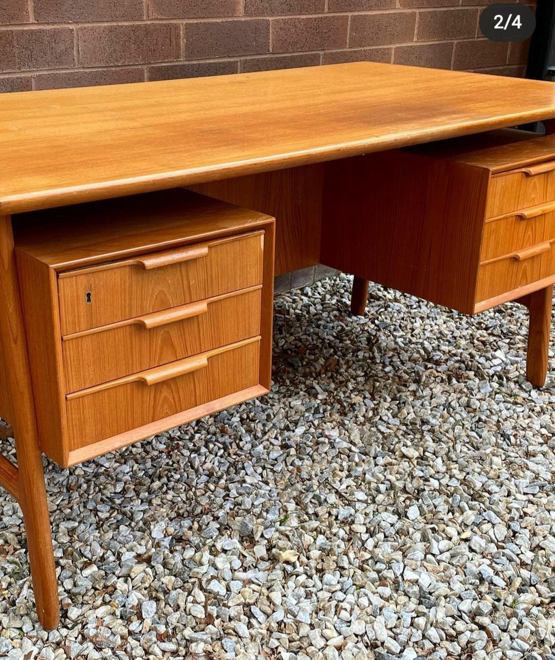 Omann Jun teak floating desk in great condition. It has storage on both sides of the desk.