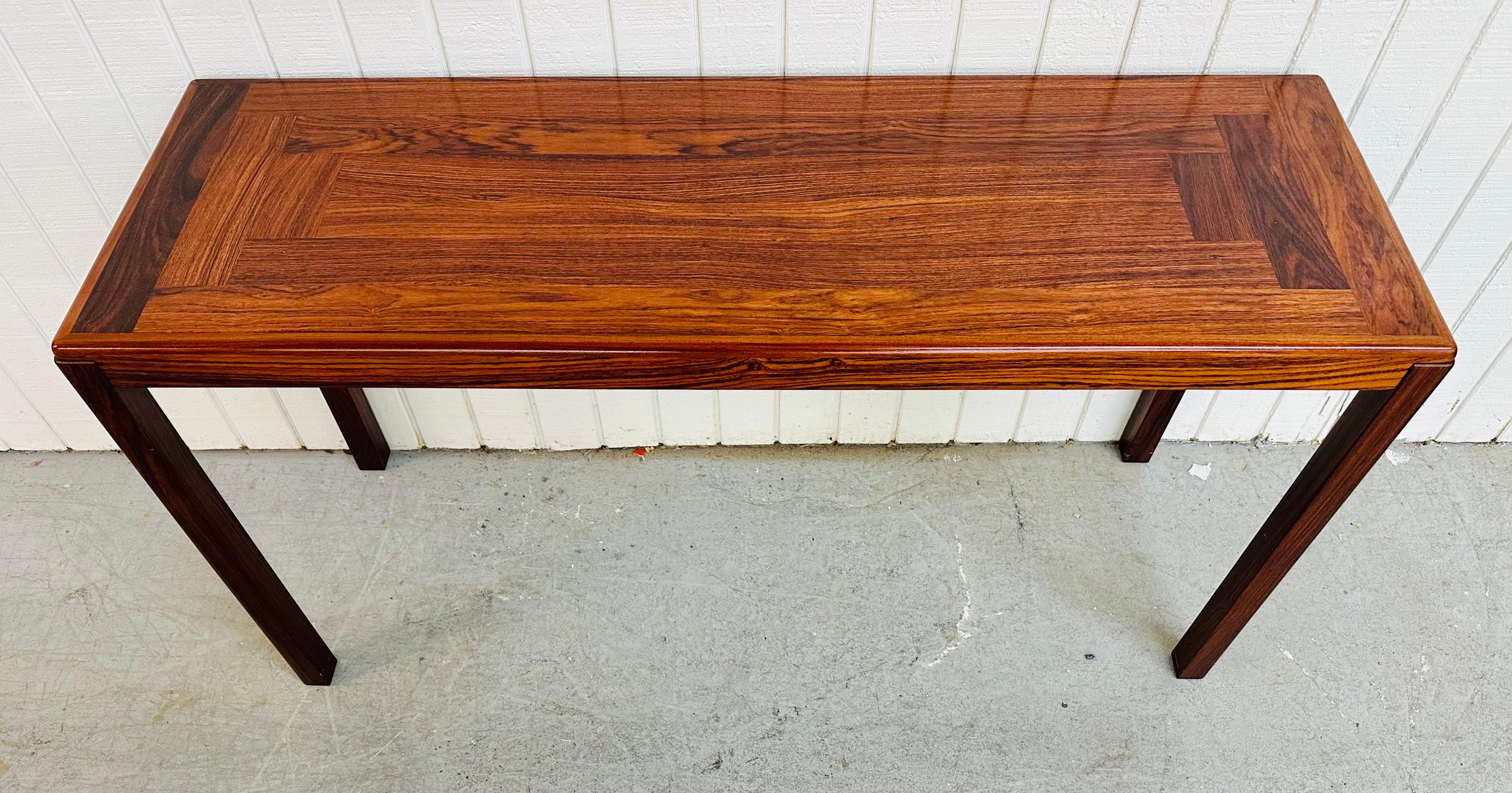 This listing is for a vintage Danish Modern Rosewood Sofa Table. Featuring a straight line design, rectangular top, four legs, and a beautiful rosewood finish. This is an exceptional combination of quality and design!