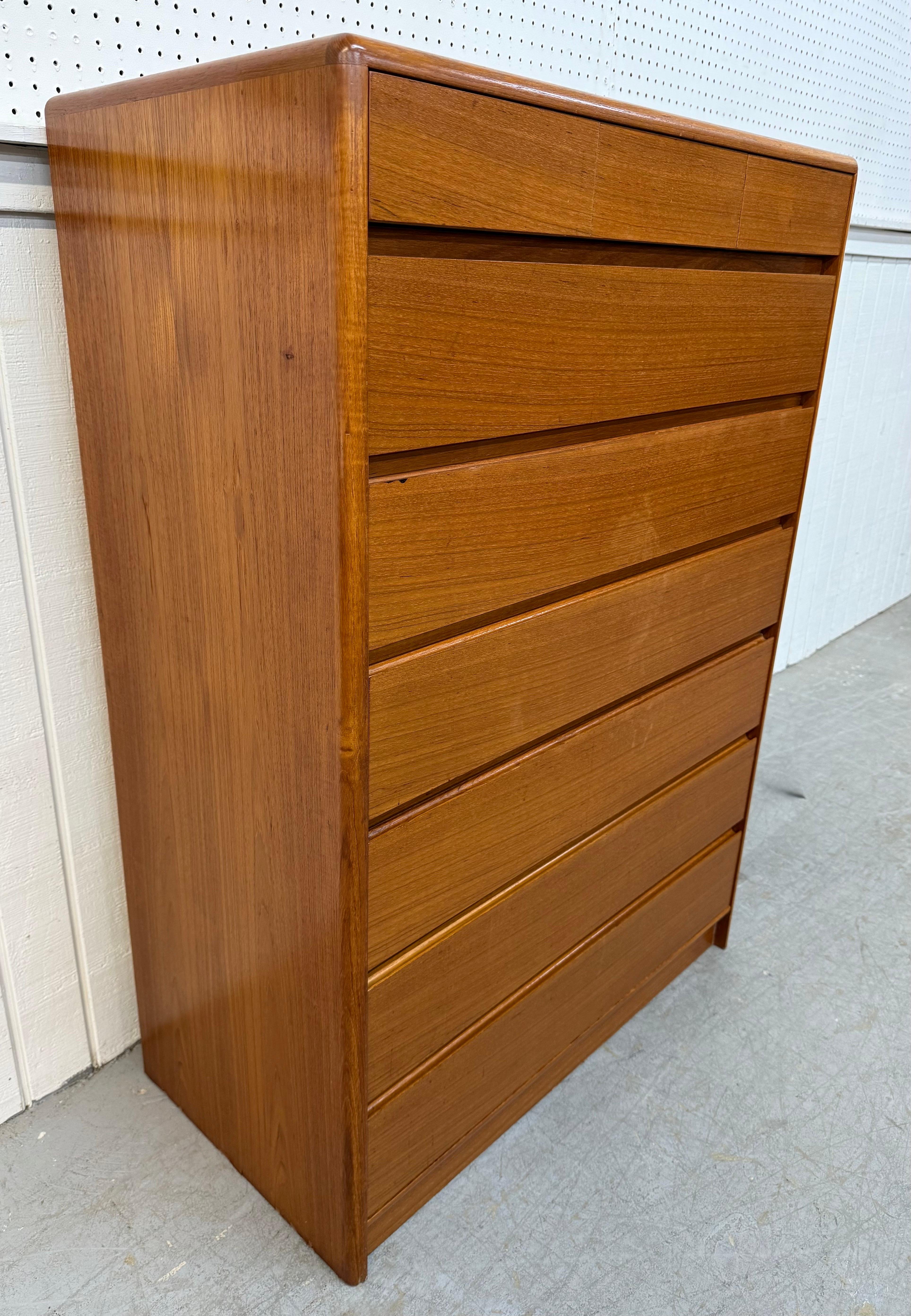 This listing is for a Vintage Danish Modern Teak 9-Drawer High Chest. Featuring a straight line design, three small drawers at the top, six larger drawers in the center/bottom, a plinth base, and a beautiful teak finish. This is an exceptional