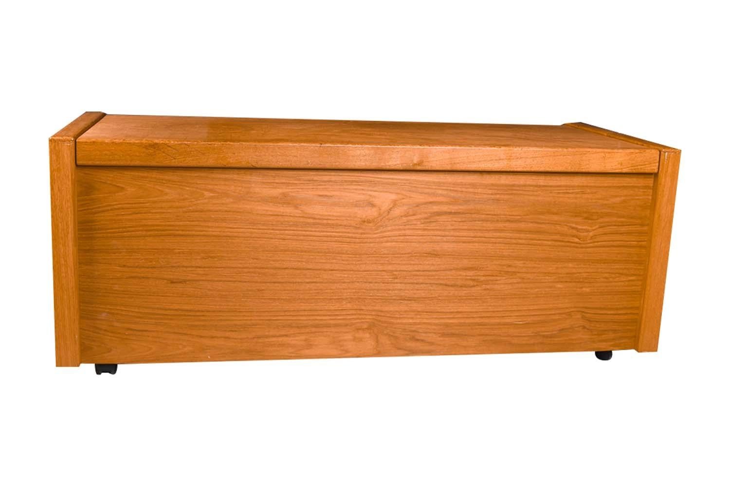 A beautiful Danish modern midcentury teak blanket storage/chest. This large vintage Danish teak blanket chest/storage trunk features spacious storage. Precisely crafted in exceptional teak wood grain, with a fully finished back and interior. The
