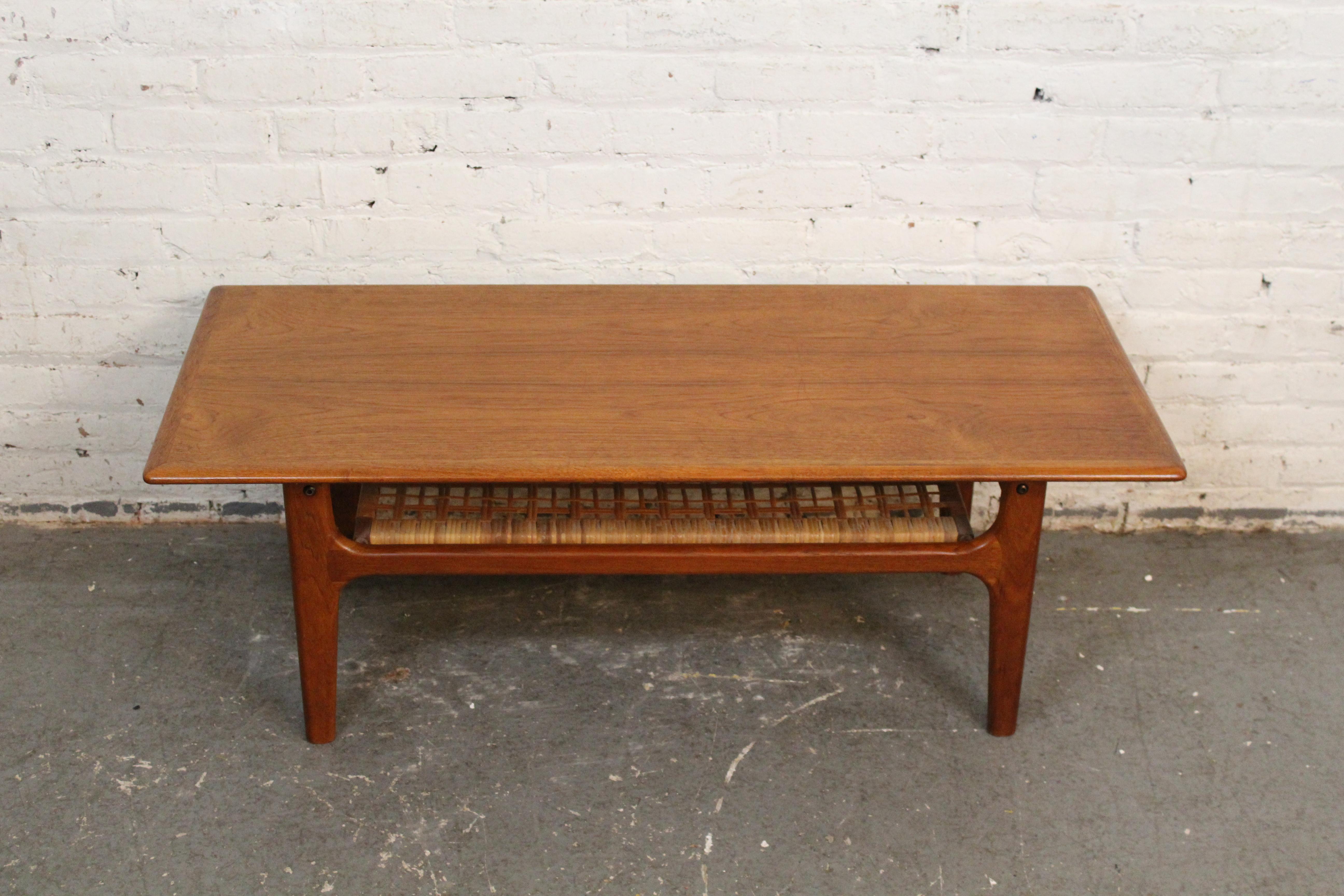Give any room a touch of classic mid-century Danish Modern design with this attractive petite coffee table by Trioh Møbelfabrik. With a compact 47”x20” footprint, it boasts a sturdy teak tabletop with an attractive grain pattern and soft rounded