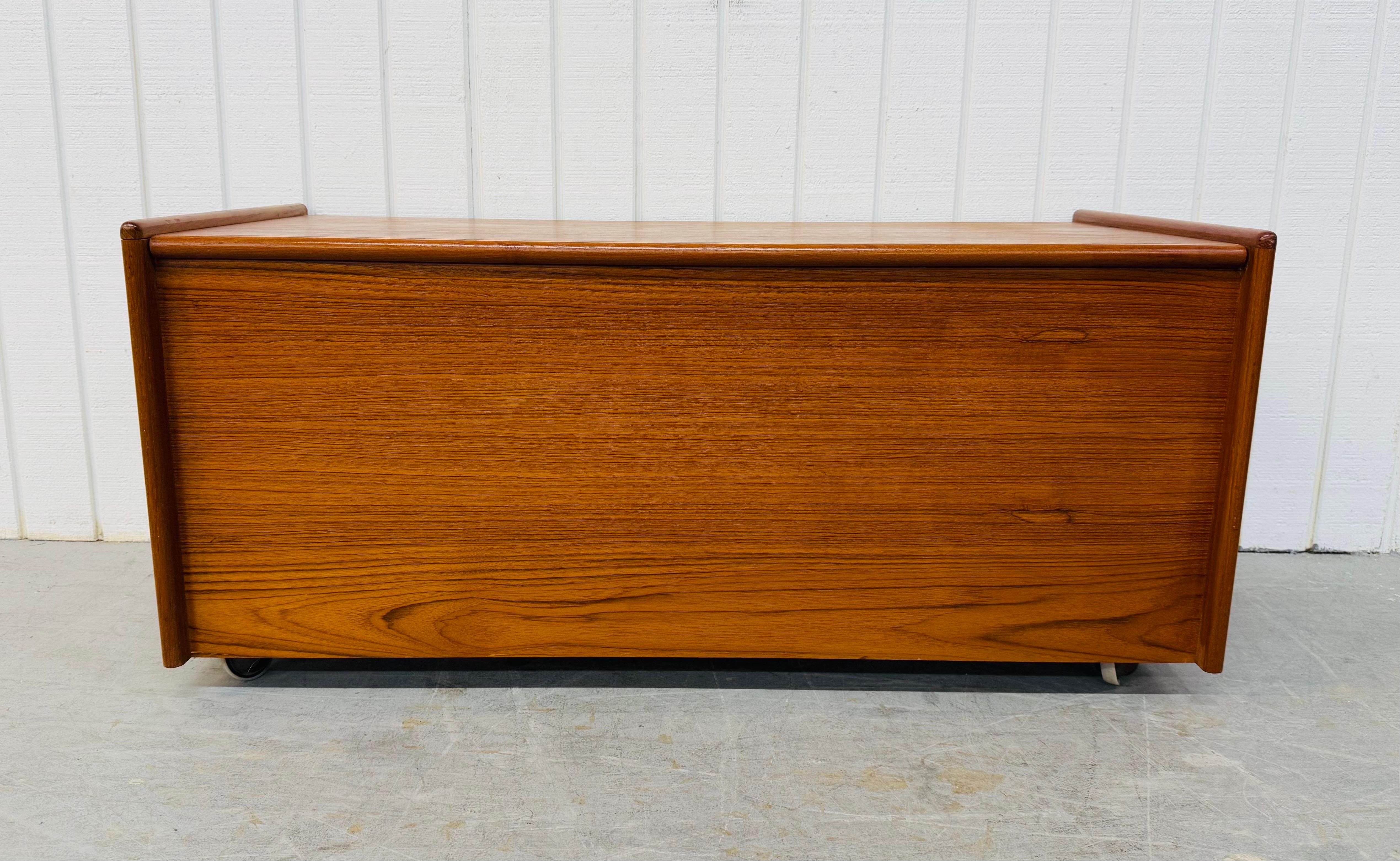 This listing is for a Vintage Danish Modern Teak Cedar Chest. Featuring a straight line design, rectangular wooden chest with flip top, cedar lined interior, casters underneath, and beautiful teak finish. This is an exceptional combination of