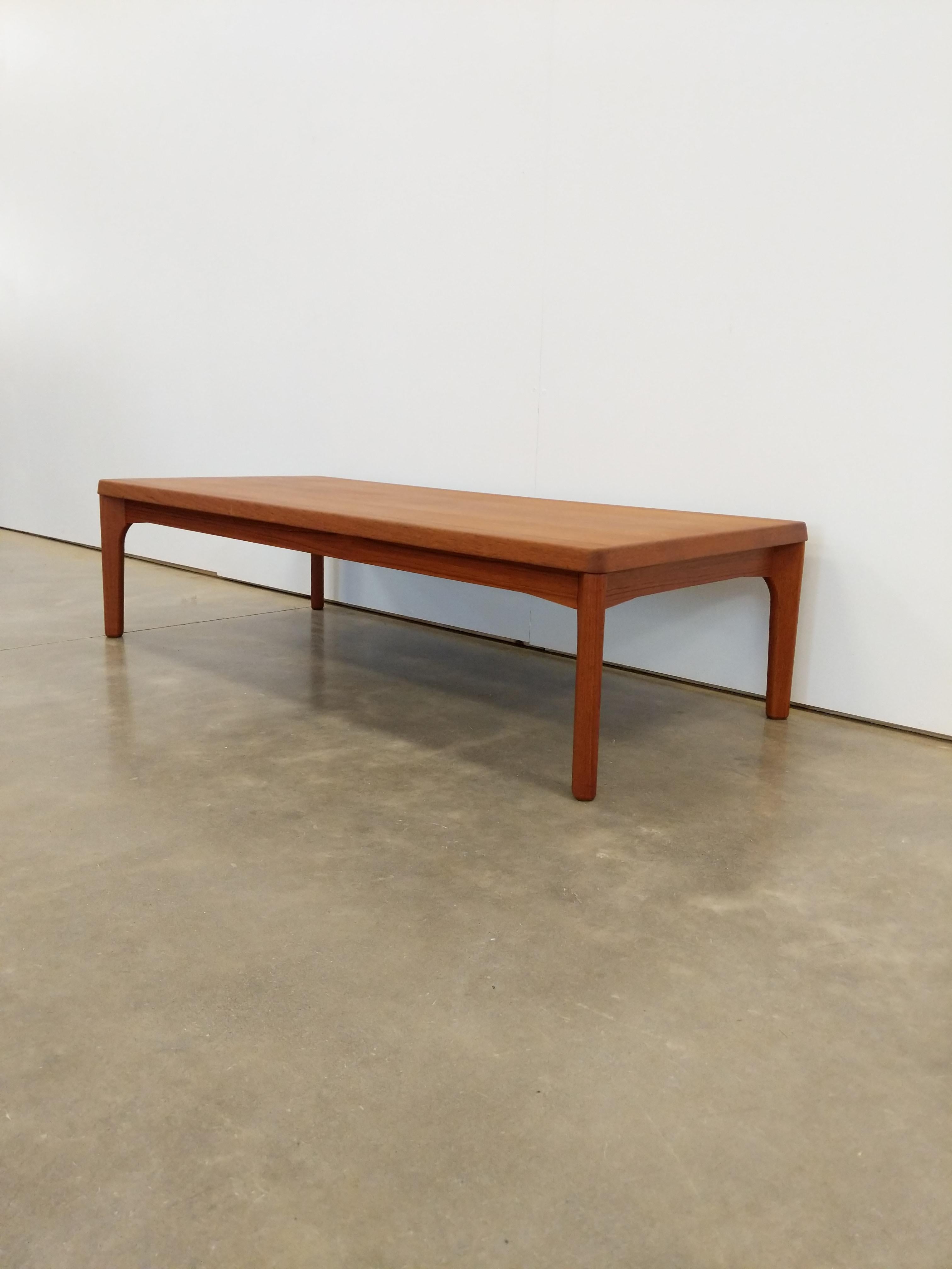 Authentic vintage Danish mid century modern teak coffee table.

Designed by Henning Kjaernulf for Vejle Stole og Møbelfabrik.

Maker's stamp on bottom.

It would be possible to use this table as a bench for an entryway or similar.

This piece is in