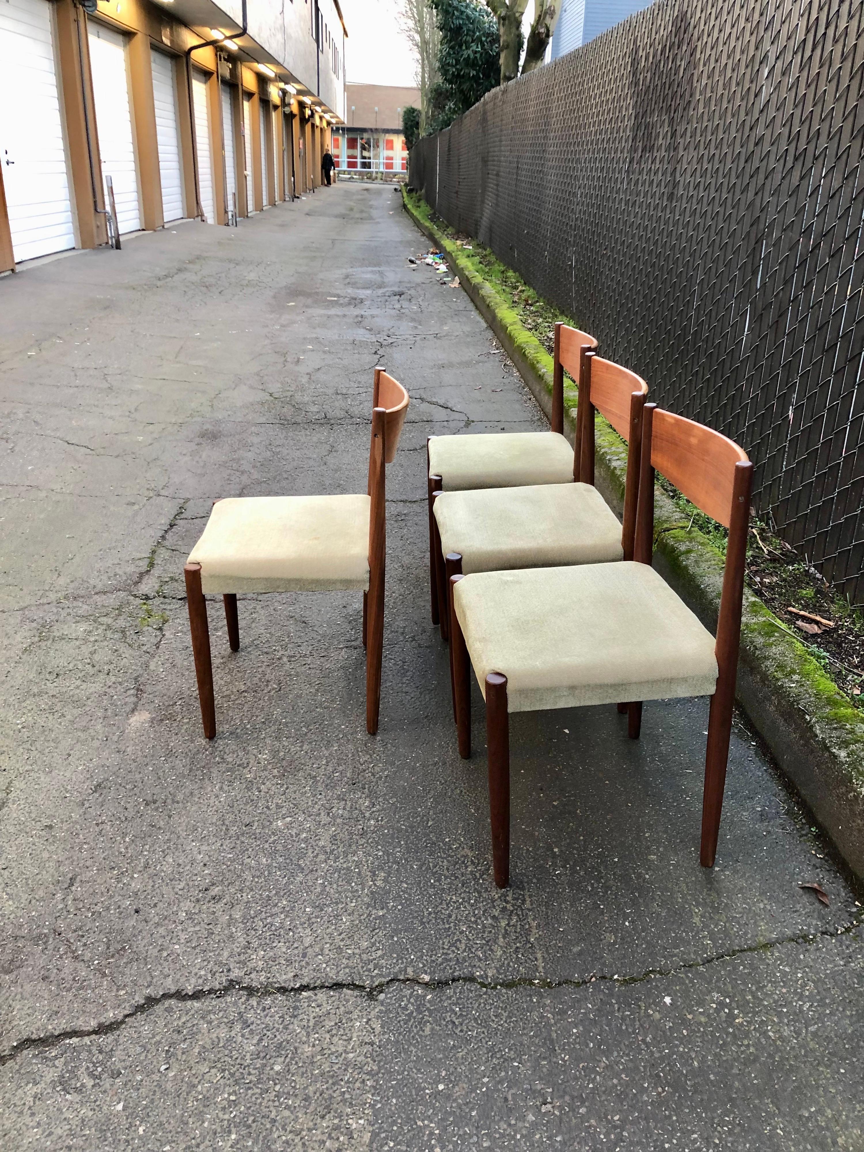 Offered is a set of 4 vintage Mid-Century Modern 1960s danish teak dining chairs. Designed by Poul Volther for Frem Rojle. The minimal design is so striking and gorgeous. Warm teak wood grain, simple lines, and curved backrest.