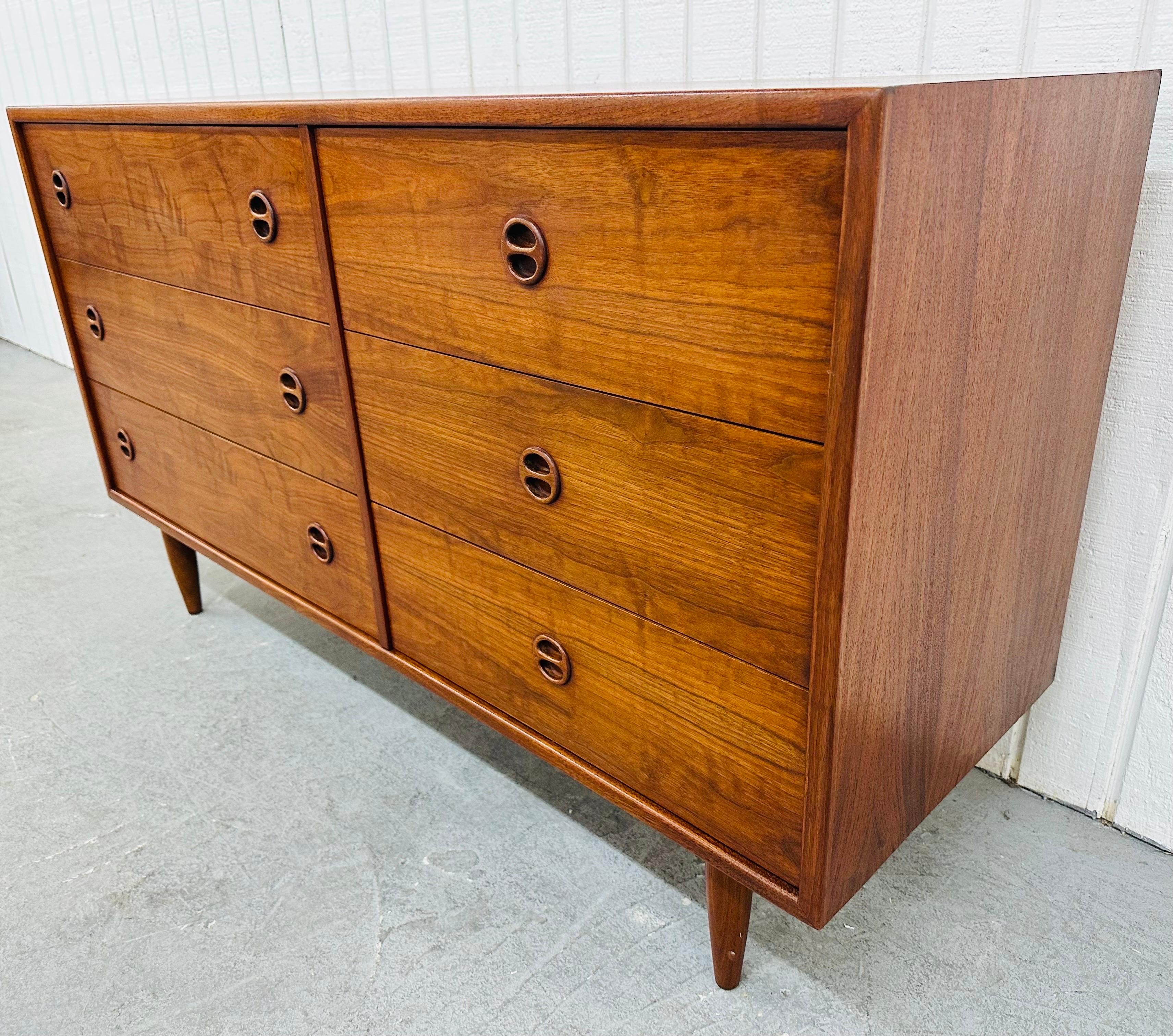 This listing is for a Vintage Danish Modern Teak Double Dresser. Featuring a straight line design, six drawers for storage, round teak pulls, modern legs, and a beautiful walnut finish. This is an exceptional combination of quality and design!