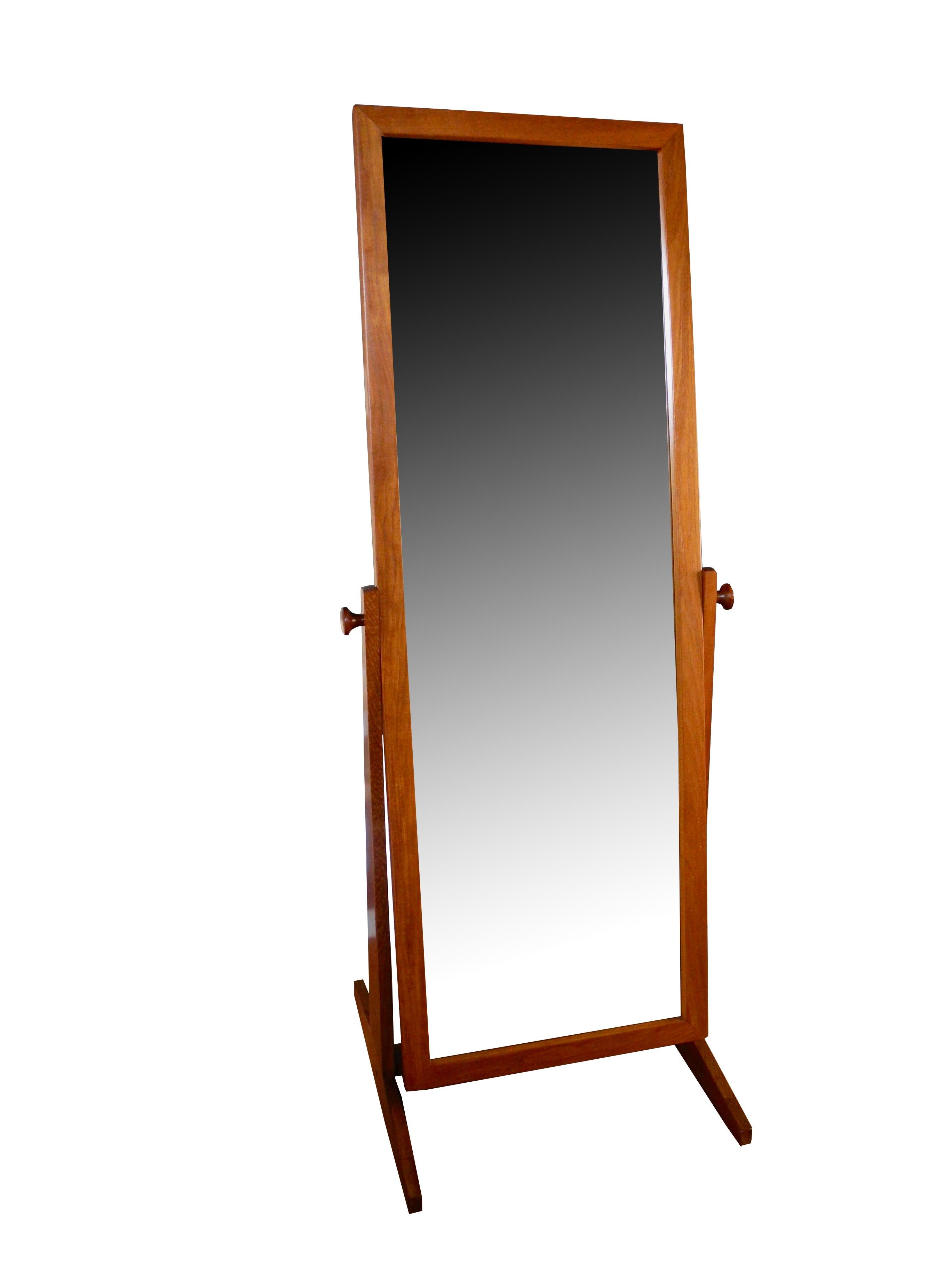 This adjustable 1960s floor mirror stands on its own and is an attractive element in any bedroom or dressing room. Made of teak in Denmark by Pedersen & Hansen. The mirror measures 21 5/8 inches wide by 62 1/2 inches long. The mirror with the footed