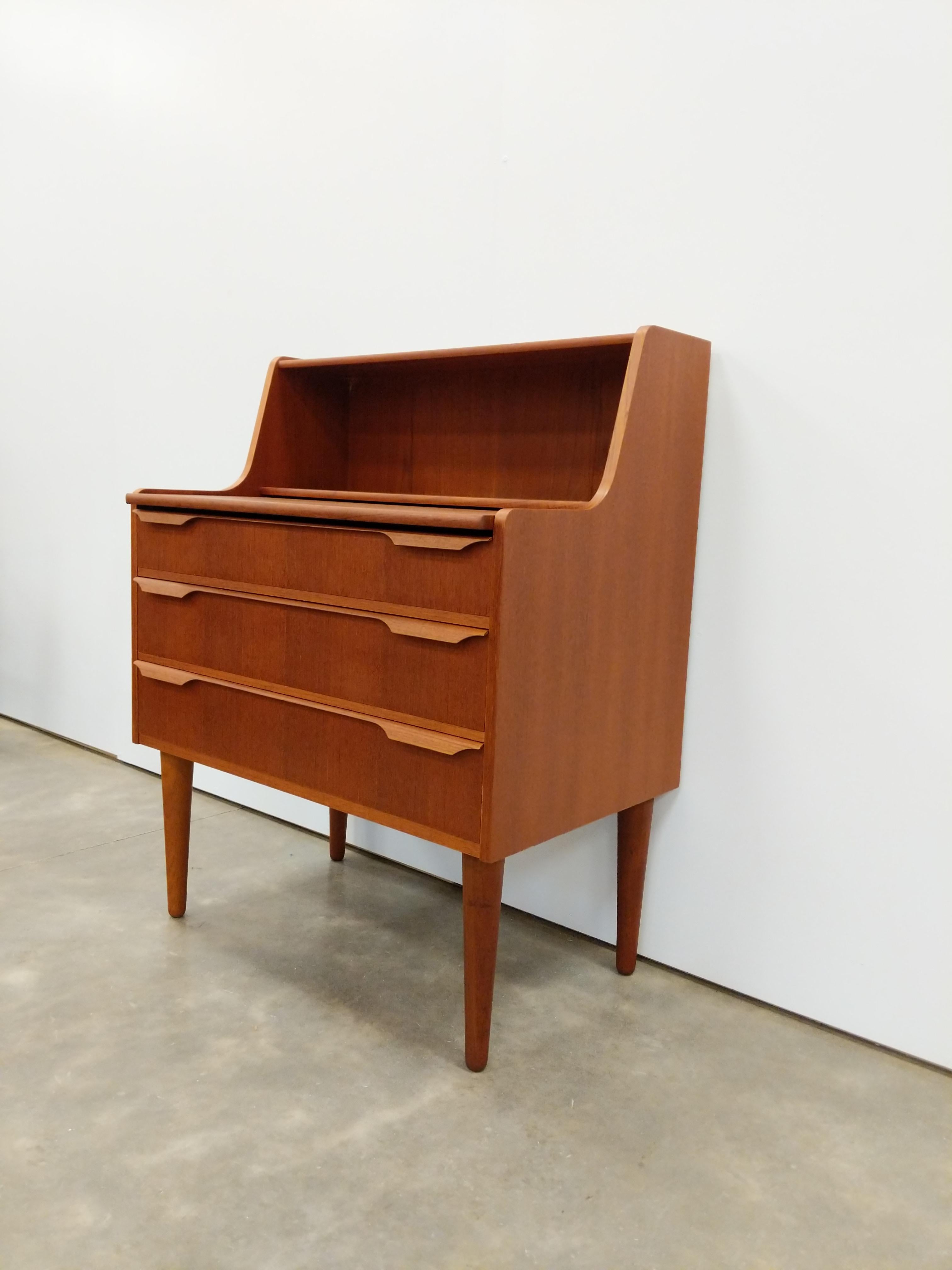 Authentic vintage mid century Danish / Scandinavian Modern teak secretary desk / vanity with mirror / dresser / chest of drawers.

By Trekanten. Maker's brand on back.

