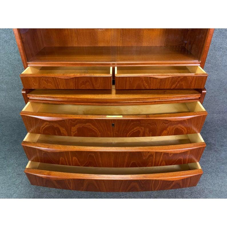 Here is a beautiful 1960s Scandinavian modern teak secretary desk with a display cabinet attributed to famed danish designer Erling Torvits that was recently imported from Copenhagen to California.
This piece features on its upper side a display